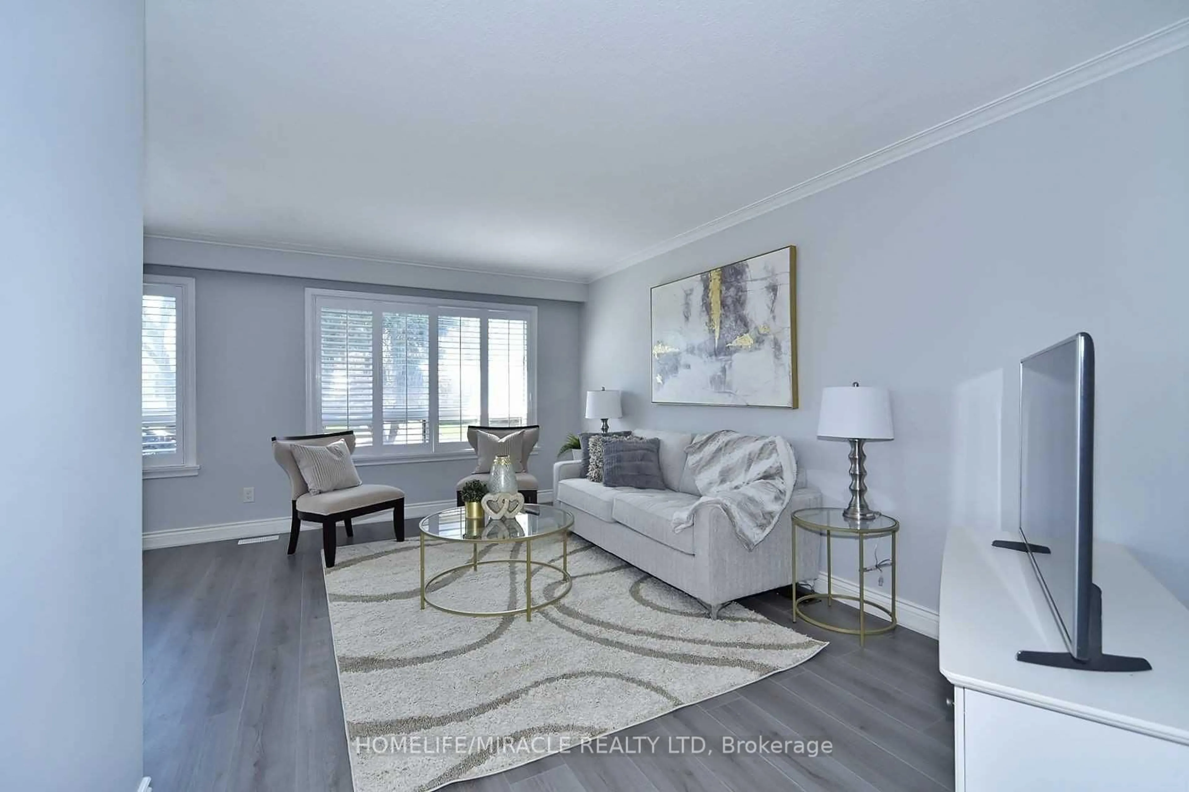 Living room with furniture, wood/laminate floor for 16 Wantanopa Cres, Toronto Ontario M1H 2B3