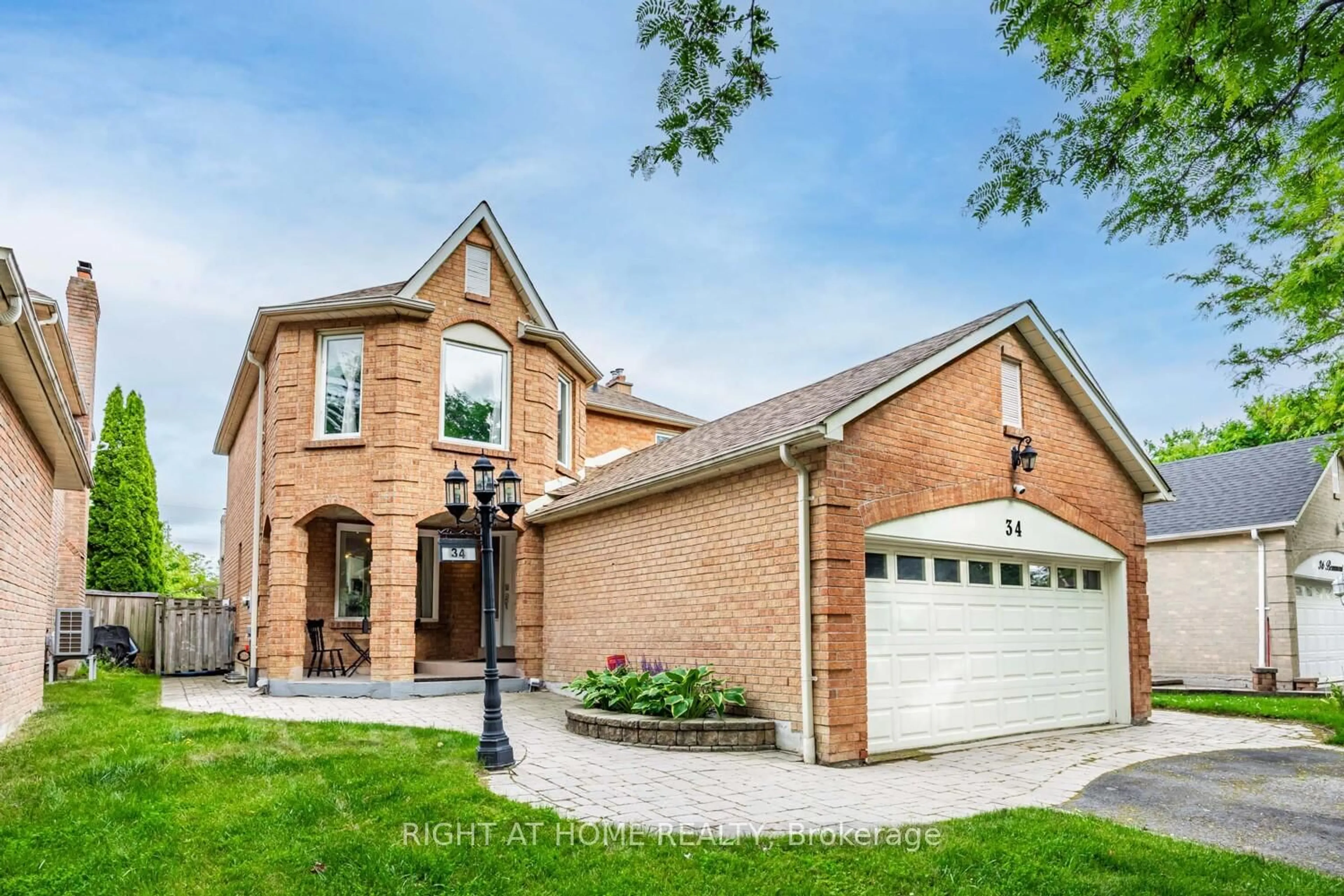 Home with brick exterior material, street for 34 Beaumont Dr, Ajax Ontario L1T 1P8