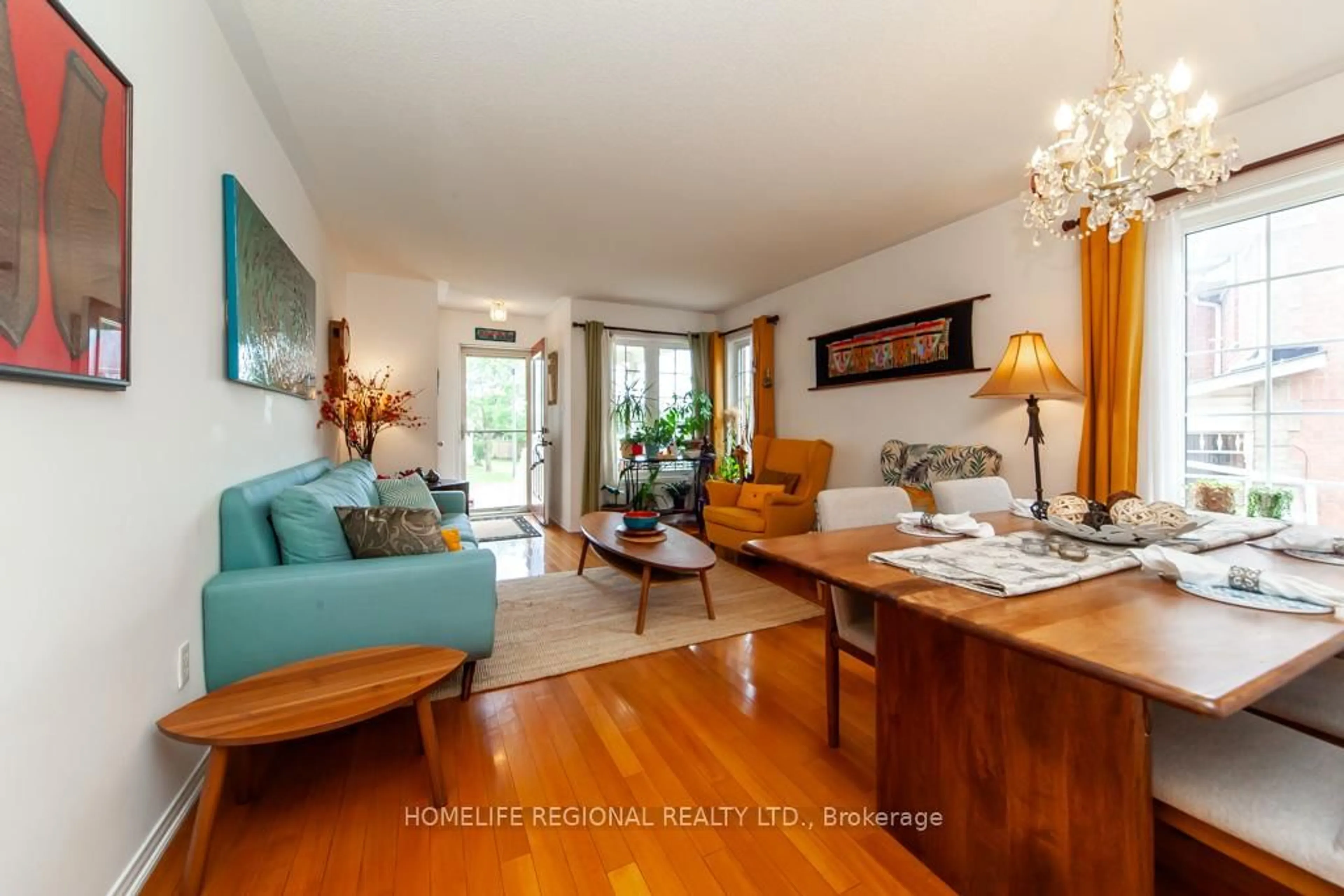 Living room with furniture, wood/laminate floor for 20 Rosemarie Cres, Whitby Ontario L1M 1G6