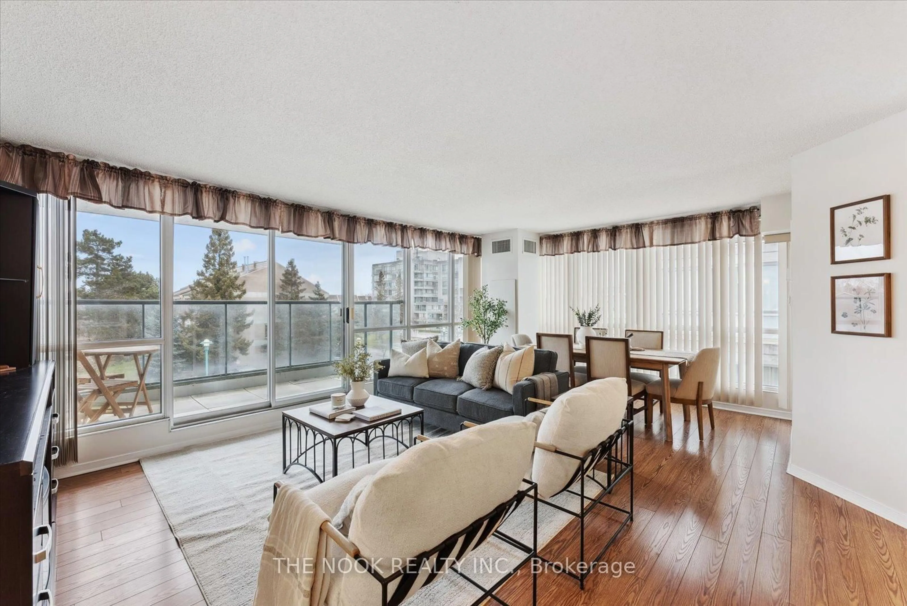 Living room with furniture, wood/laminate floor for 70 Cumberland Lane #309, Ajax Ontario L1S 7K2