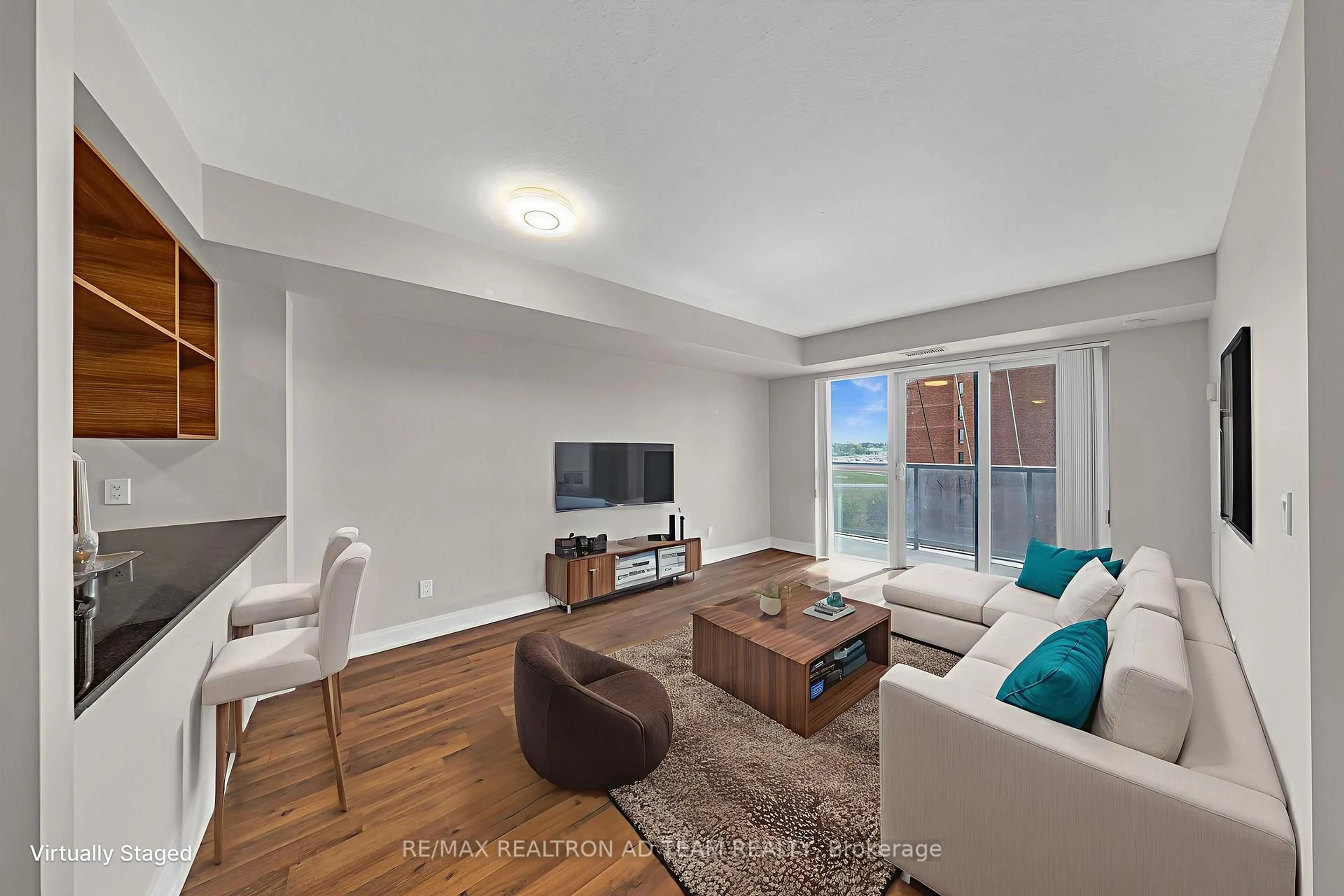 Living room with furniture, wood/laminate floor for 125 Village Green Sq #706, Toronto Ontario M1S 0G3