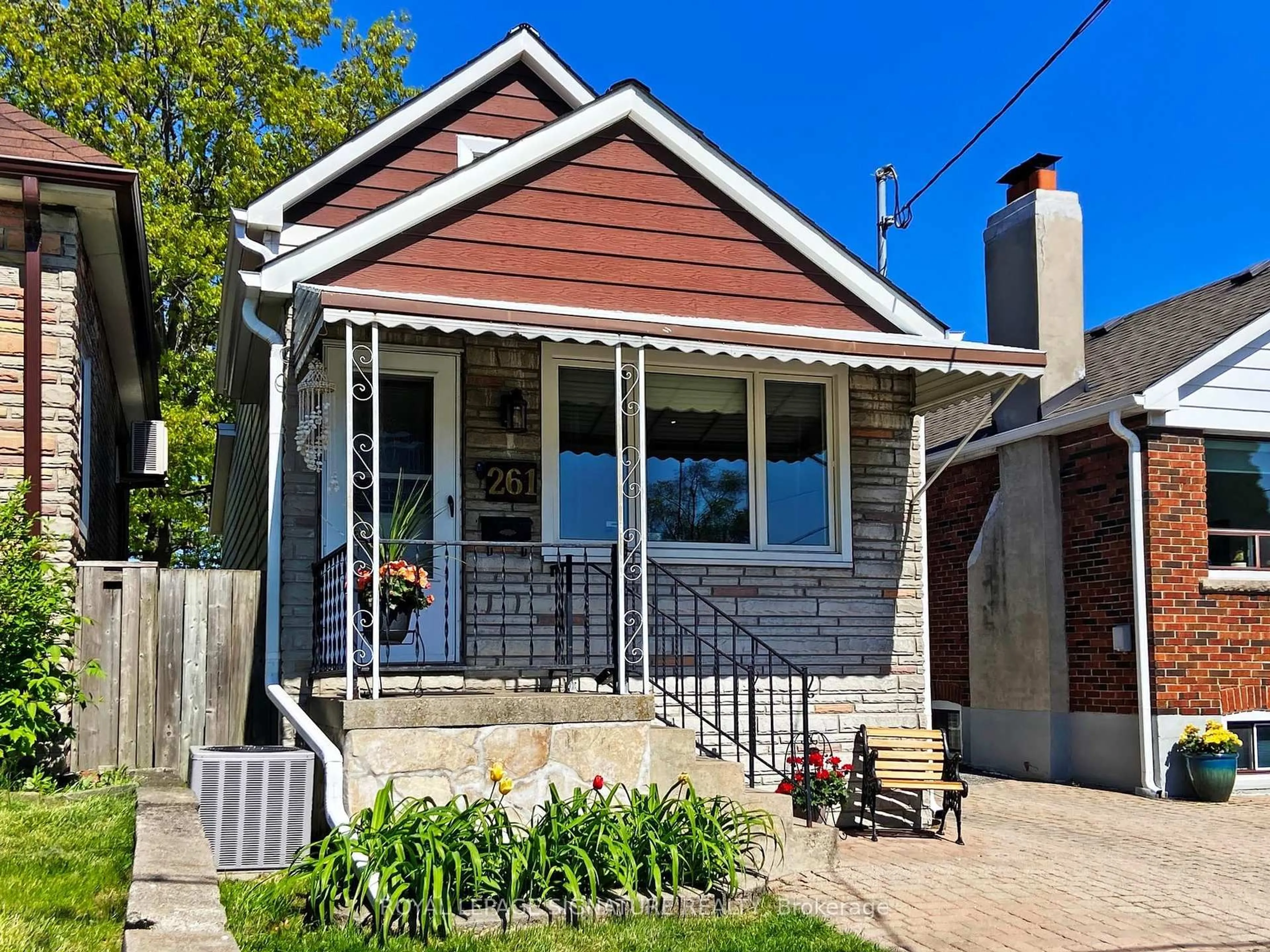 Home with brick exterior material, street for 261 Glebemount Ave, Toronto Ontario M4C 3T7