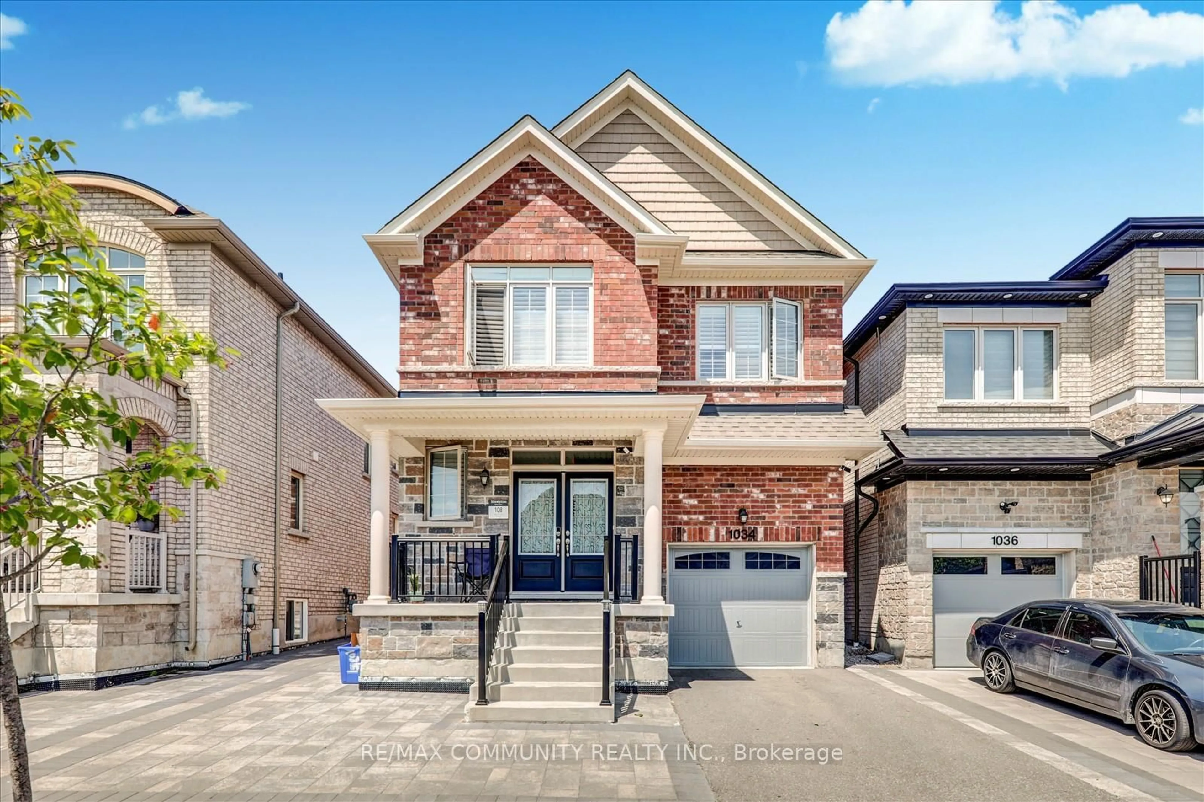 Home with brick exterior material, street for 1034 Pelican Tr, Pickering Ontario L1X 0G7
