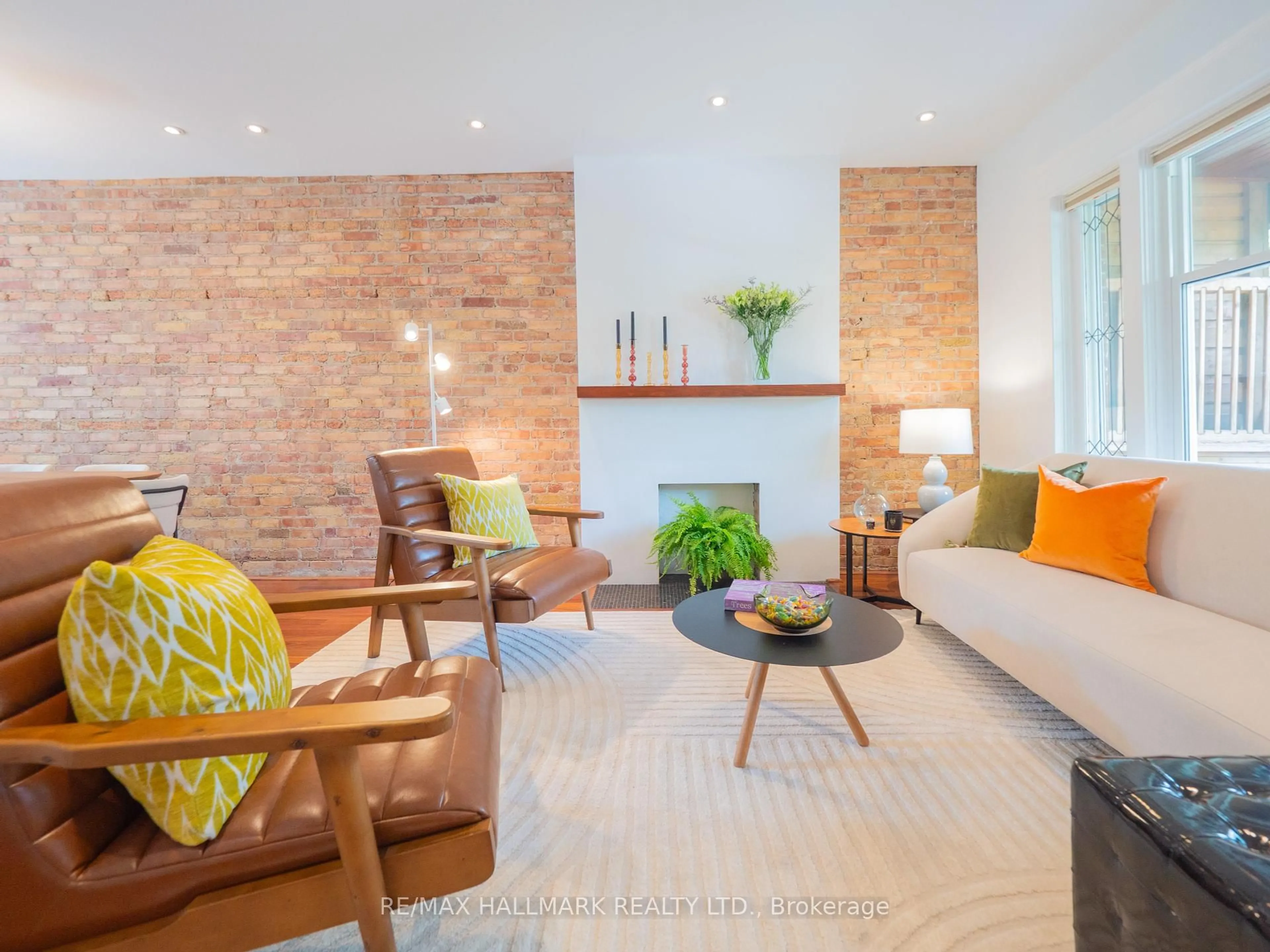 Living room with furniture, wood/laminate floor for 51 Bain Ave, Toronto Ontario M4K 1E5