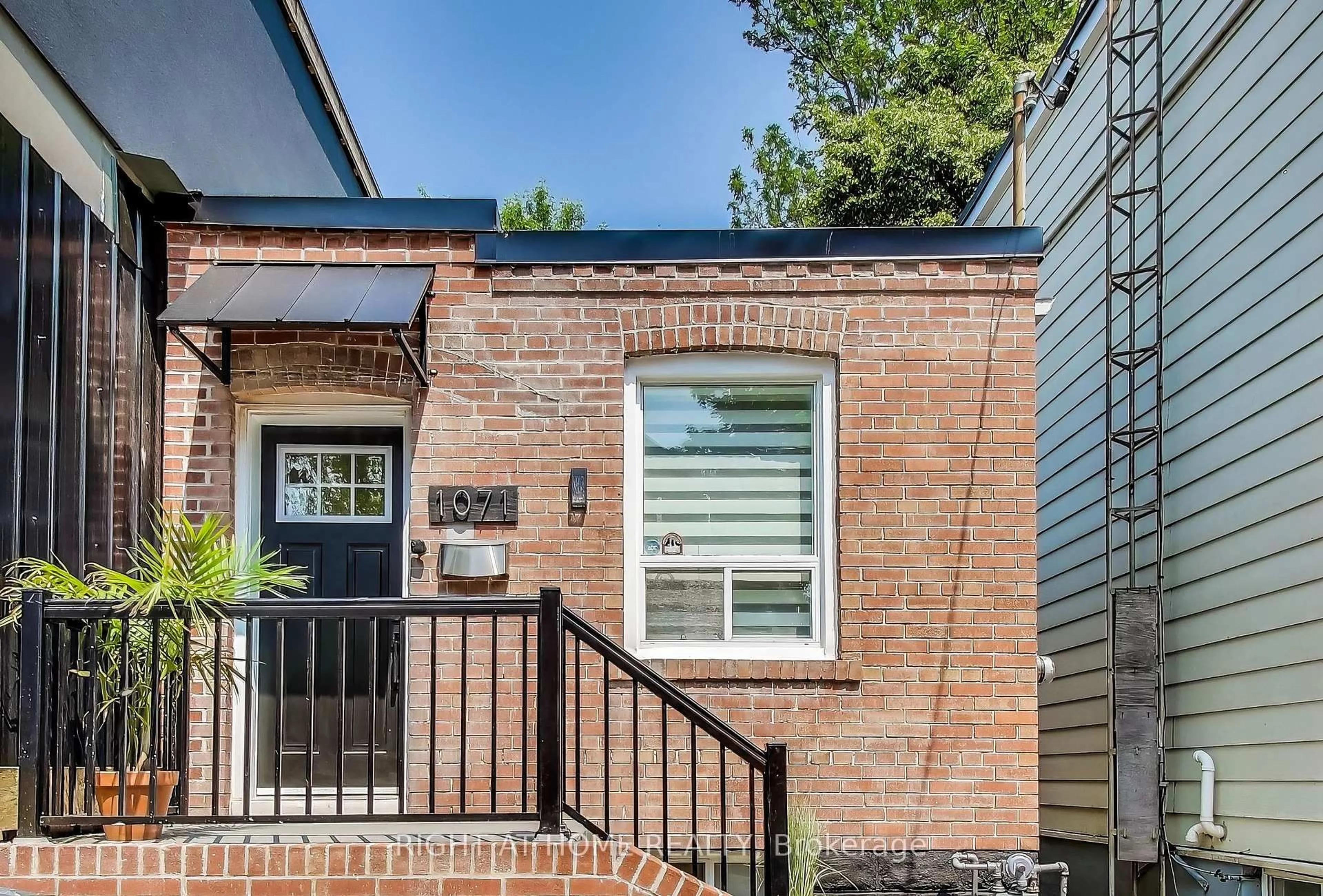 Home with brick exterior material, street for 1071 Craven Rd, Toronto Ontario M4J 4V7