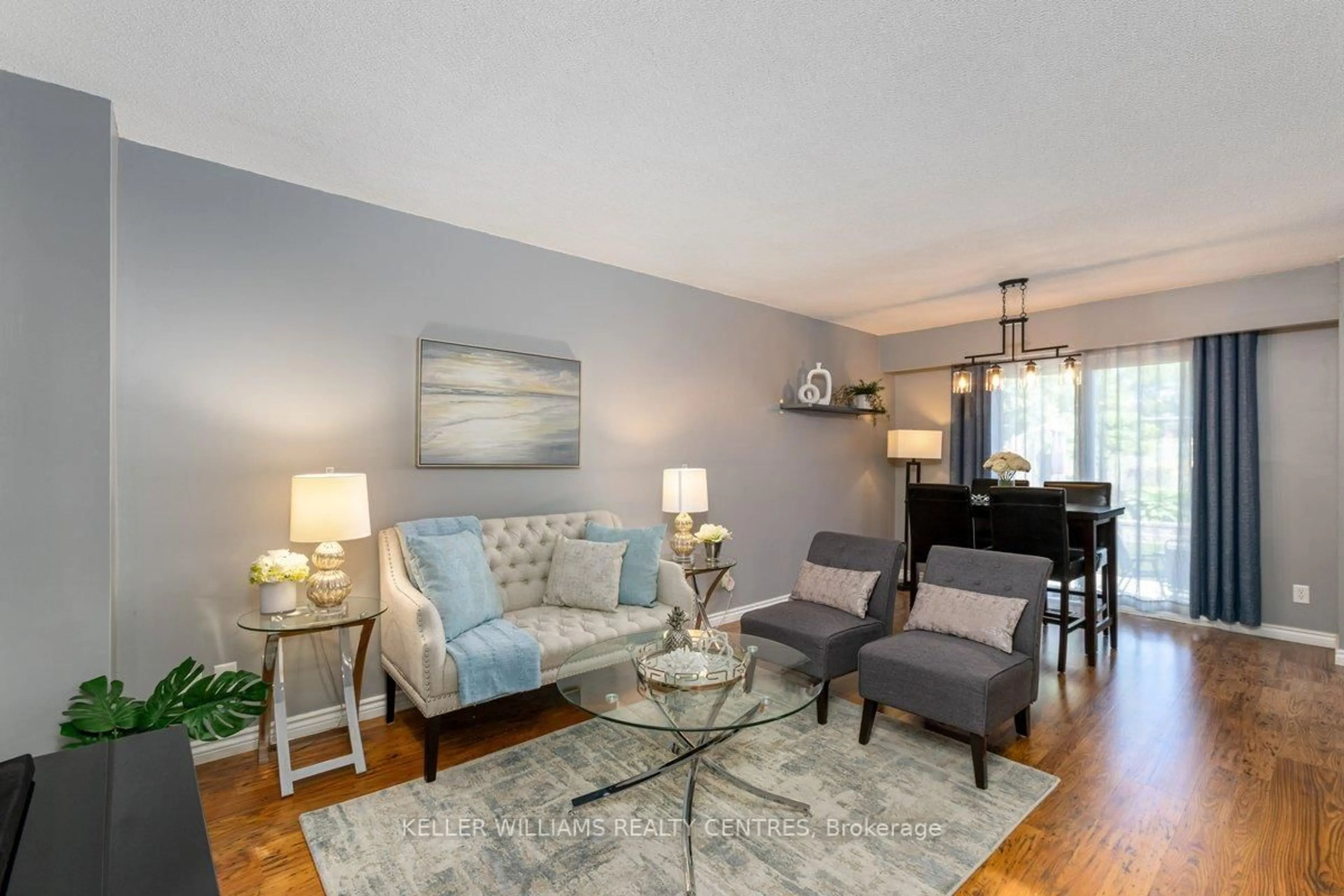 Living room with furniture, wood/laminate floor for 905 Gentry Cres, Oshawa Ontario L1K 1L6