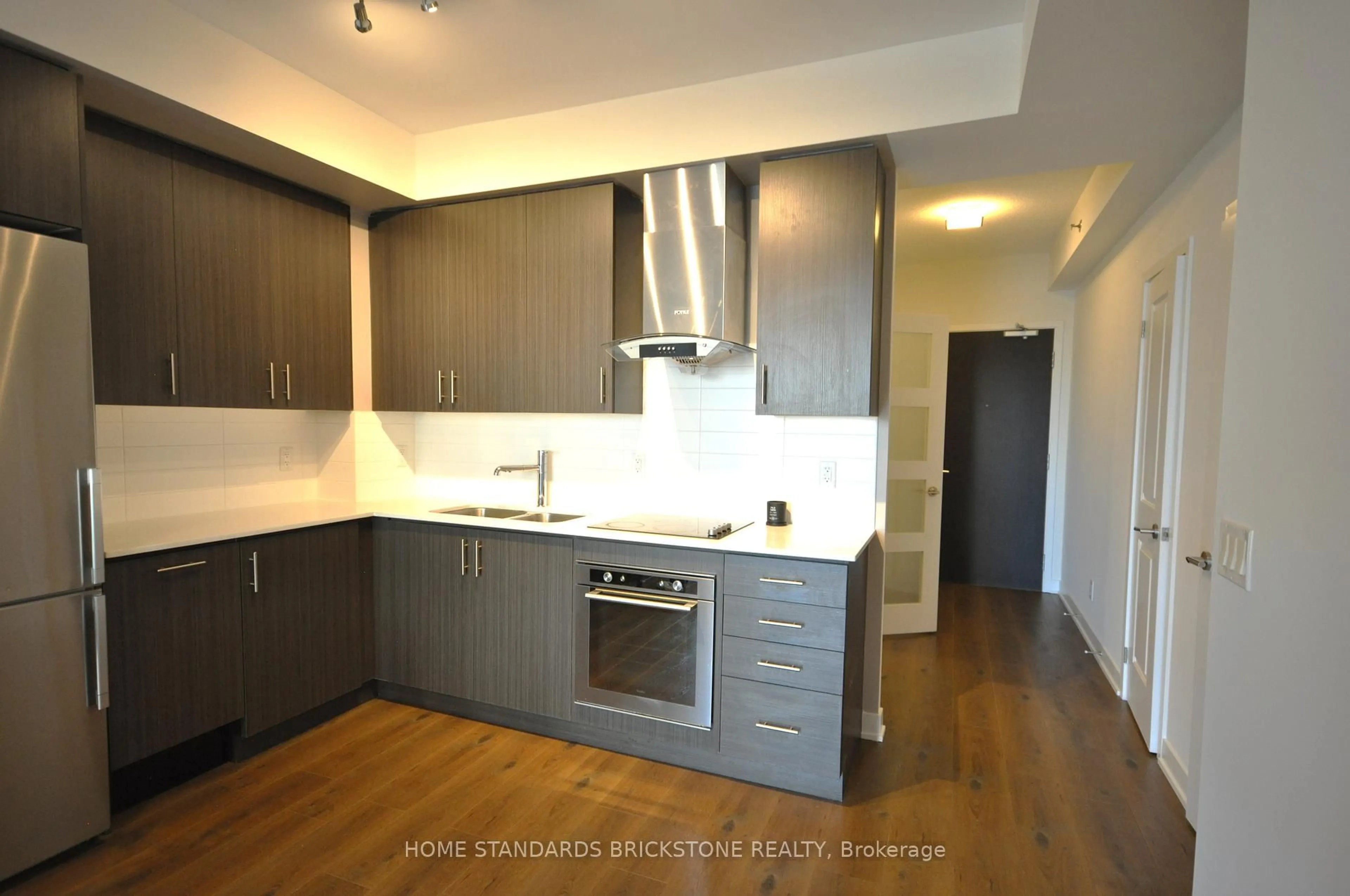 Standard kitchen, wood/laminate floor for 195 Bonis Ave #406, Toronto Ontario M1T 0A5