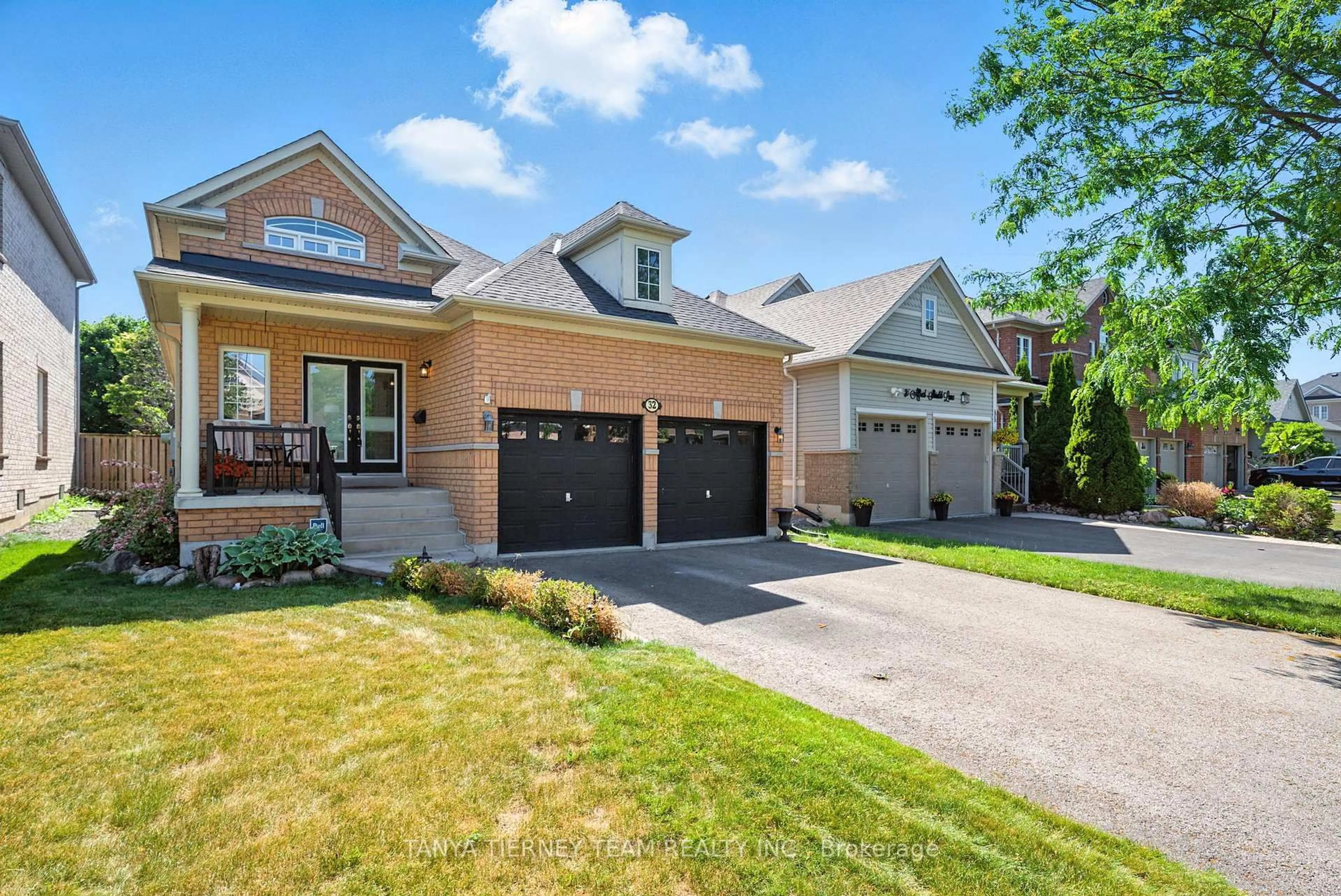 Home with brick exterior material, street for 32 Alfred Shrubb Lane, Clarington Ontario L1C 0B2