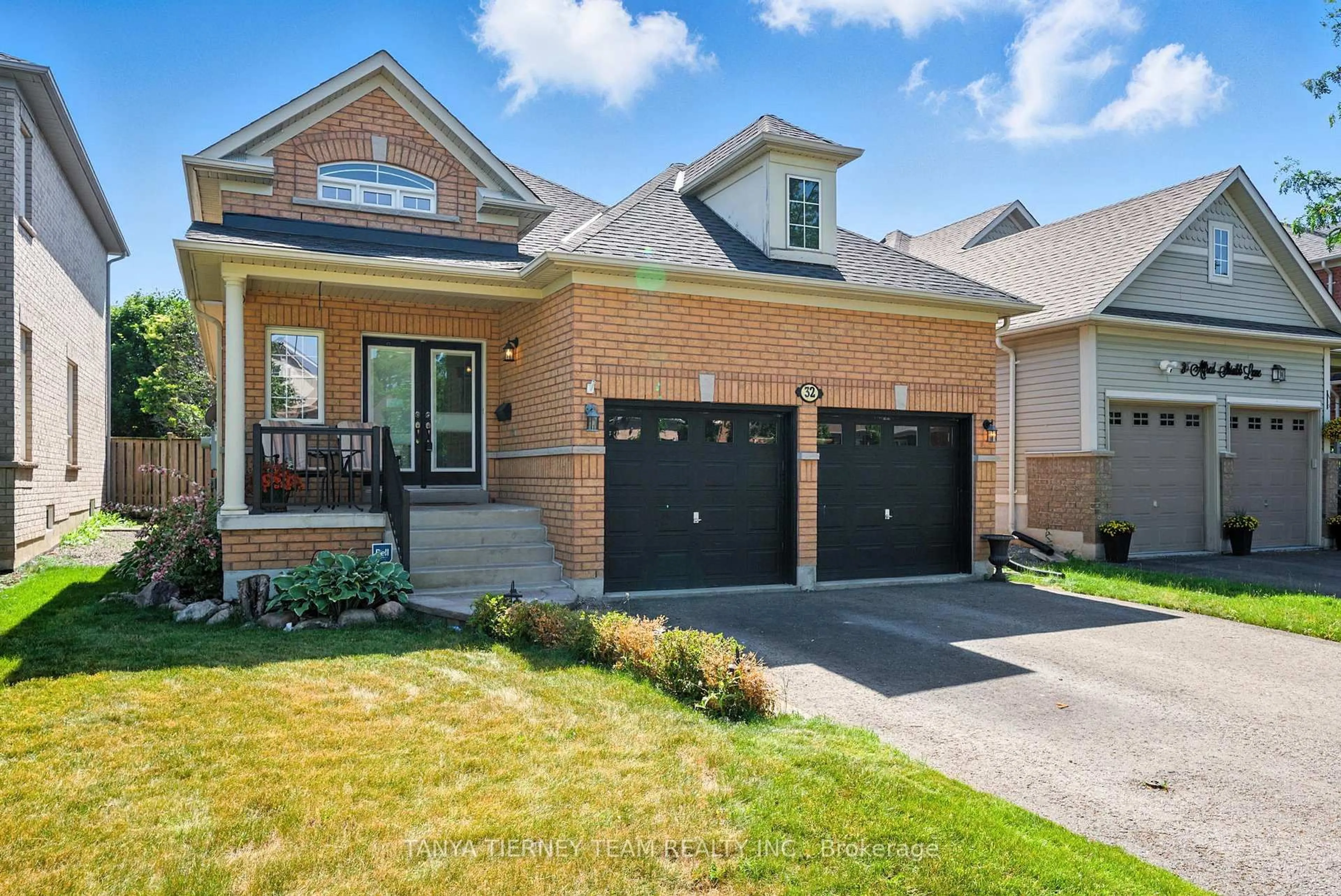 Home with brick exterior material, street for 32 Alfred Shrubb Lane, Clarington Ontario L1C 0B2