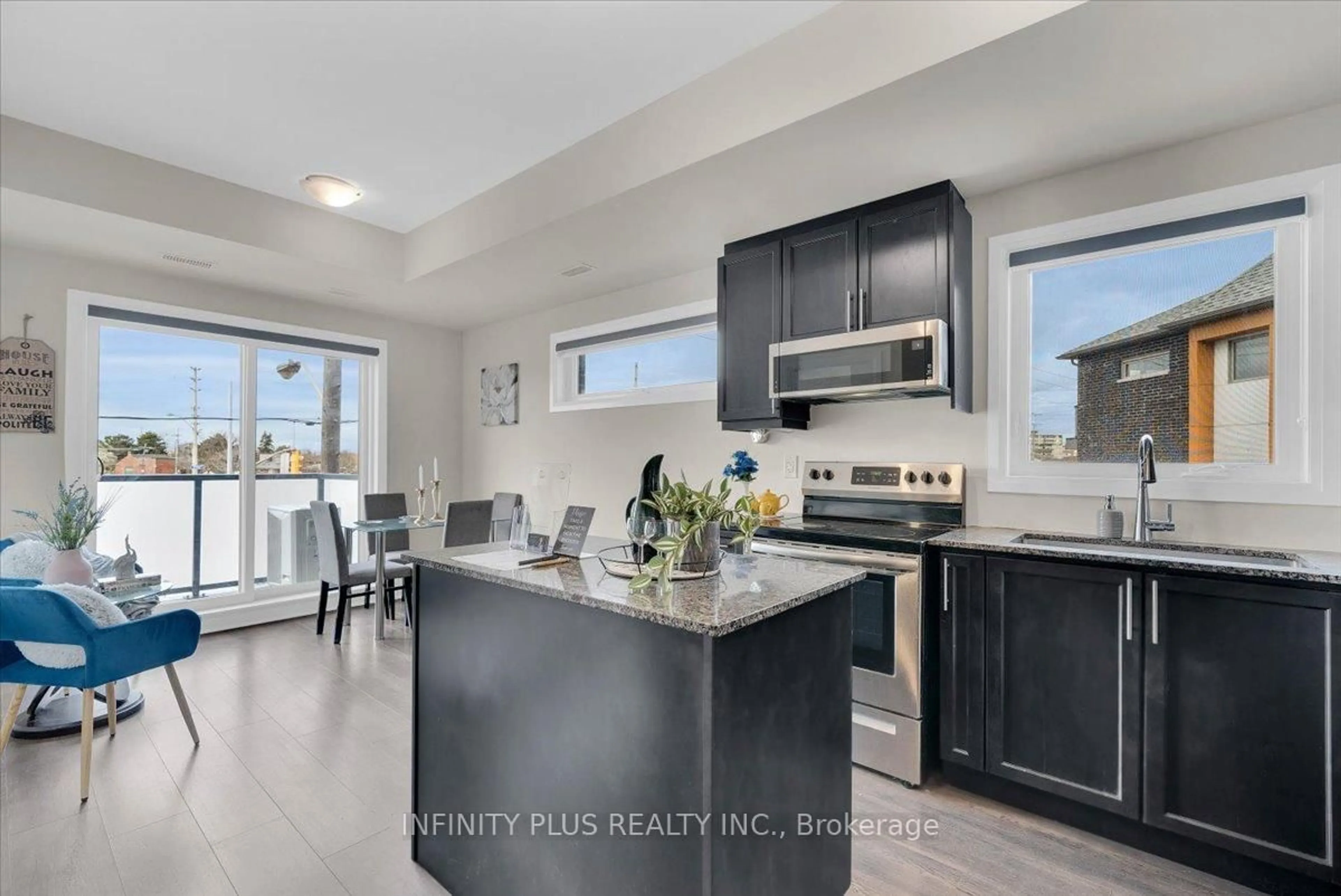 Open concept kitchen, ceramic/tile floor for 1085 Danforth Rd #202, Toronto Ontario M1J 0B2