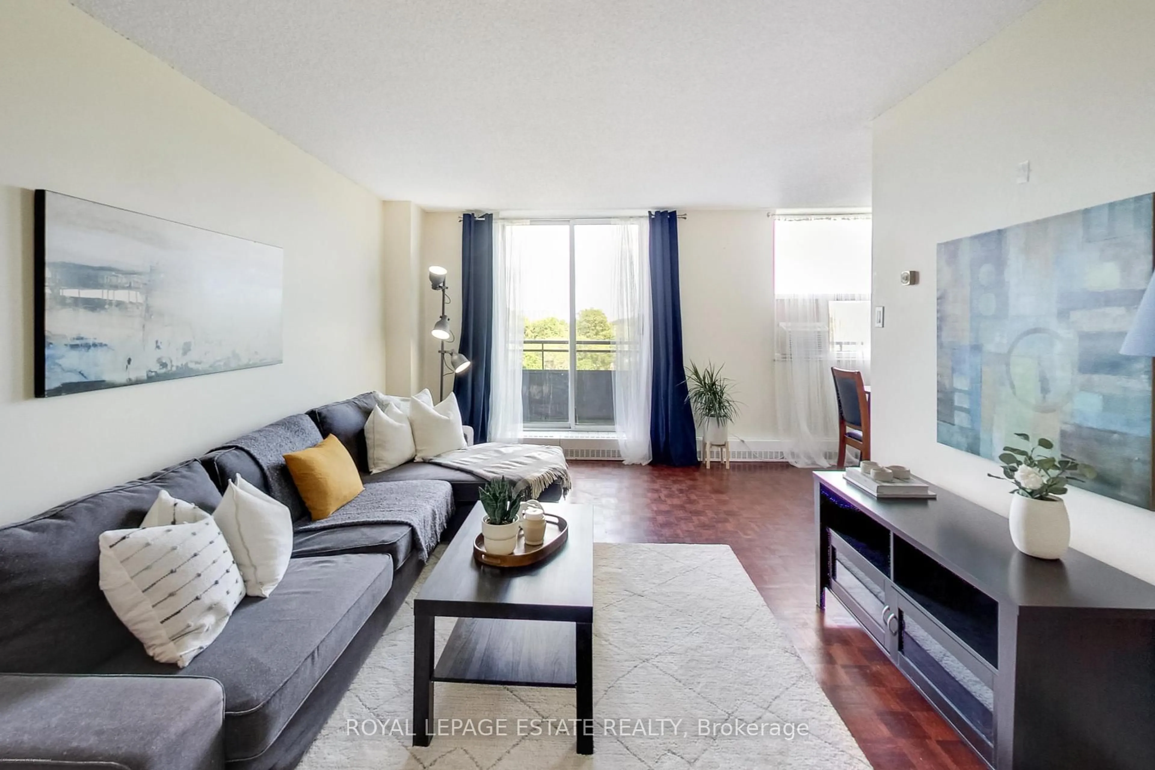 Living room with furniture, wood/laminate floor for 1071 woodbine Ave #408, Toronto Ontario M4C 4C2