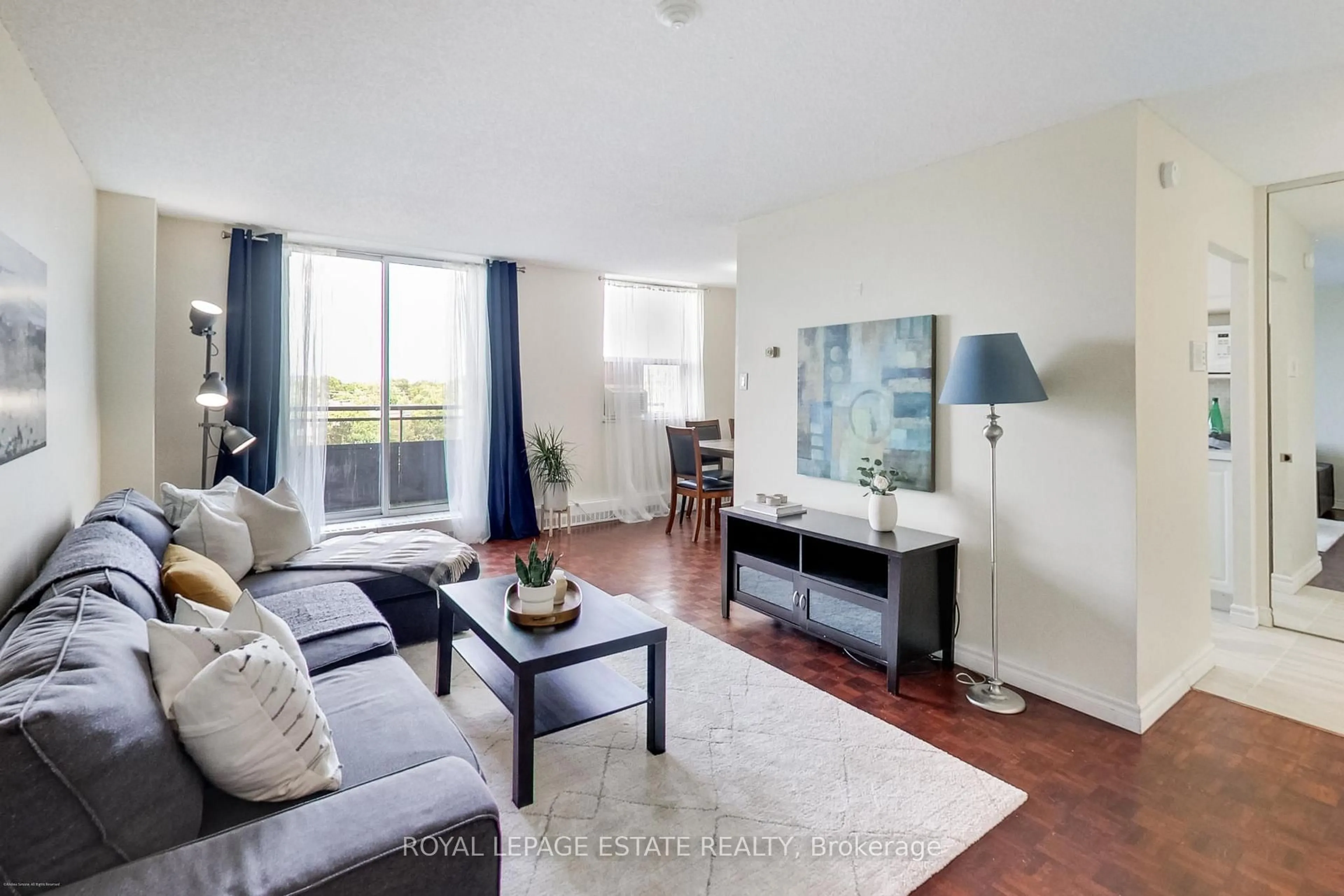 Living room with furniture, wood/laminate floor for 1071 woodbine Ave #408, Toronto Ontario M4C 4C2