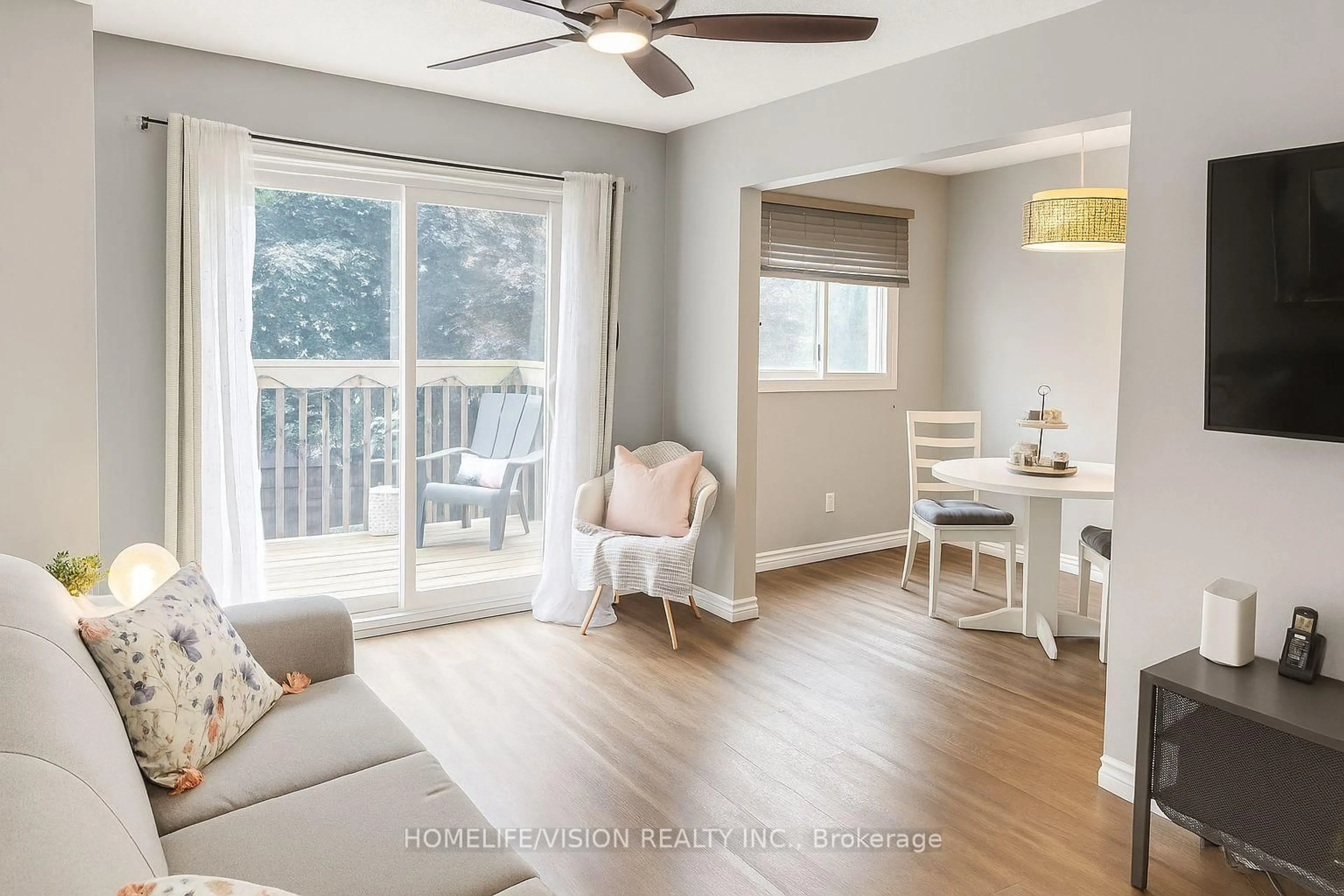 Living room with furniture, wood/laminate floor for 700 Harmony Rd #46, Oshawa Ontario L1G 7R9