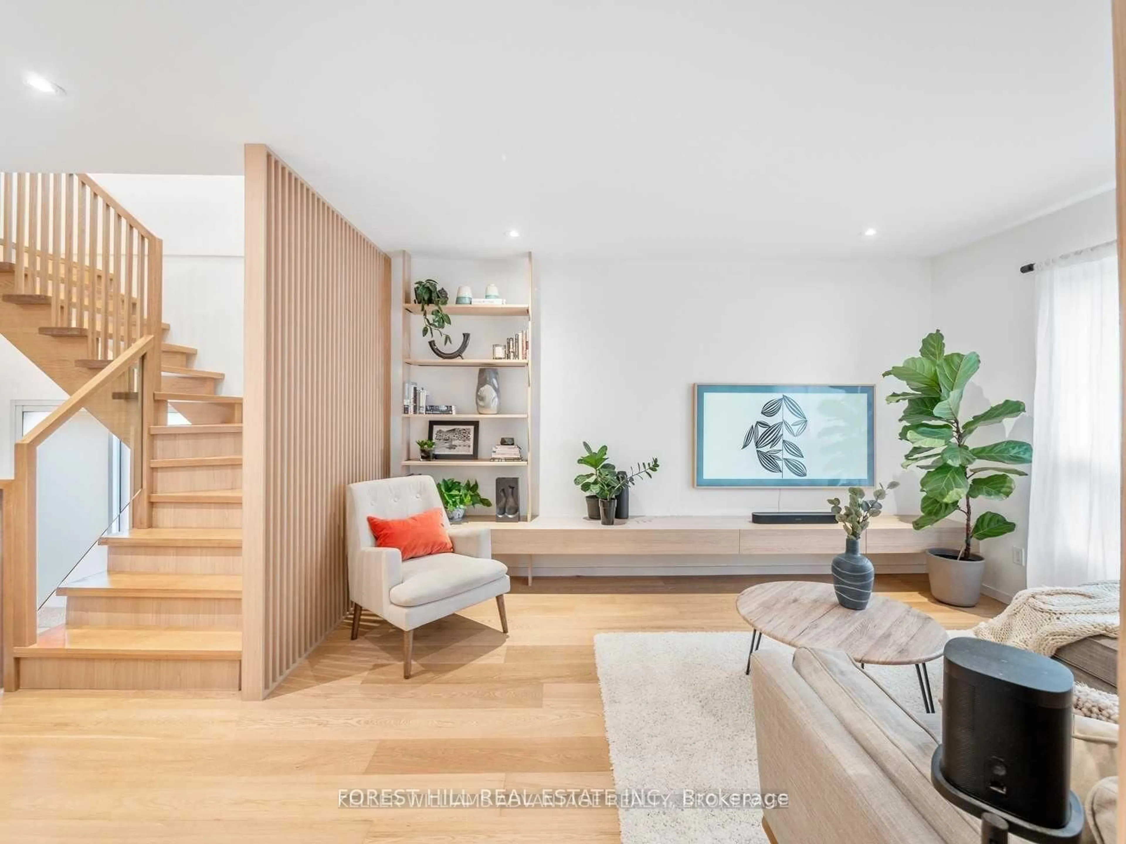 Living room with furniture, wood/laminate floor for 125 Torrens Ave, Toronto Ontario M4J 2P6