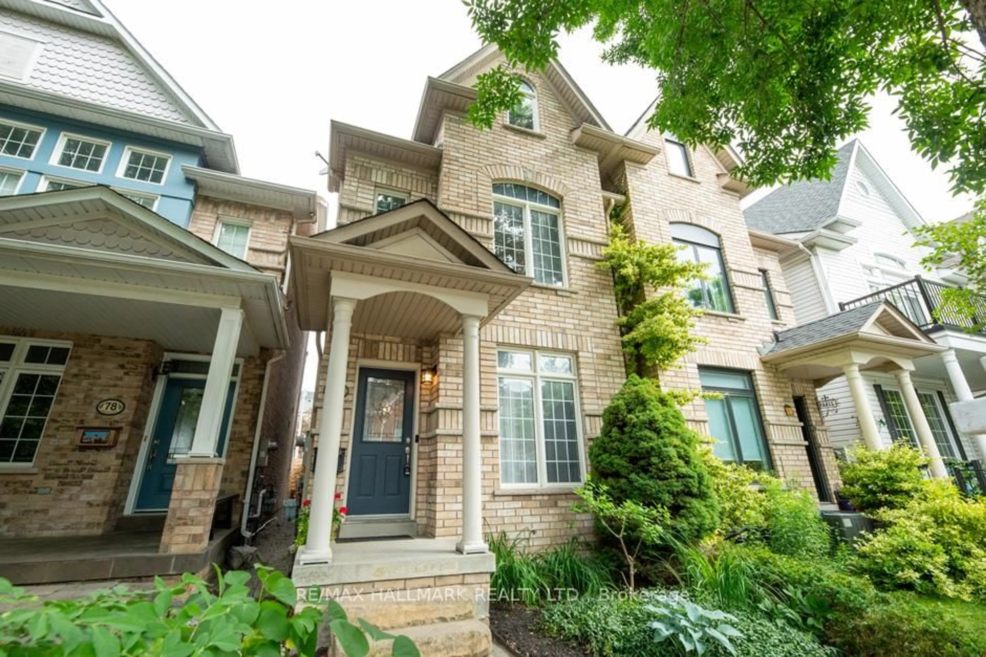 Home with brick exterior material, street for 80 Crossovers St, Toronto Ontario M4E 3X4