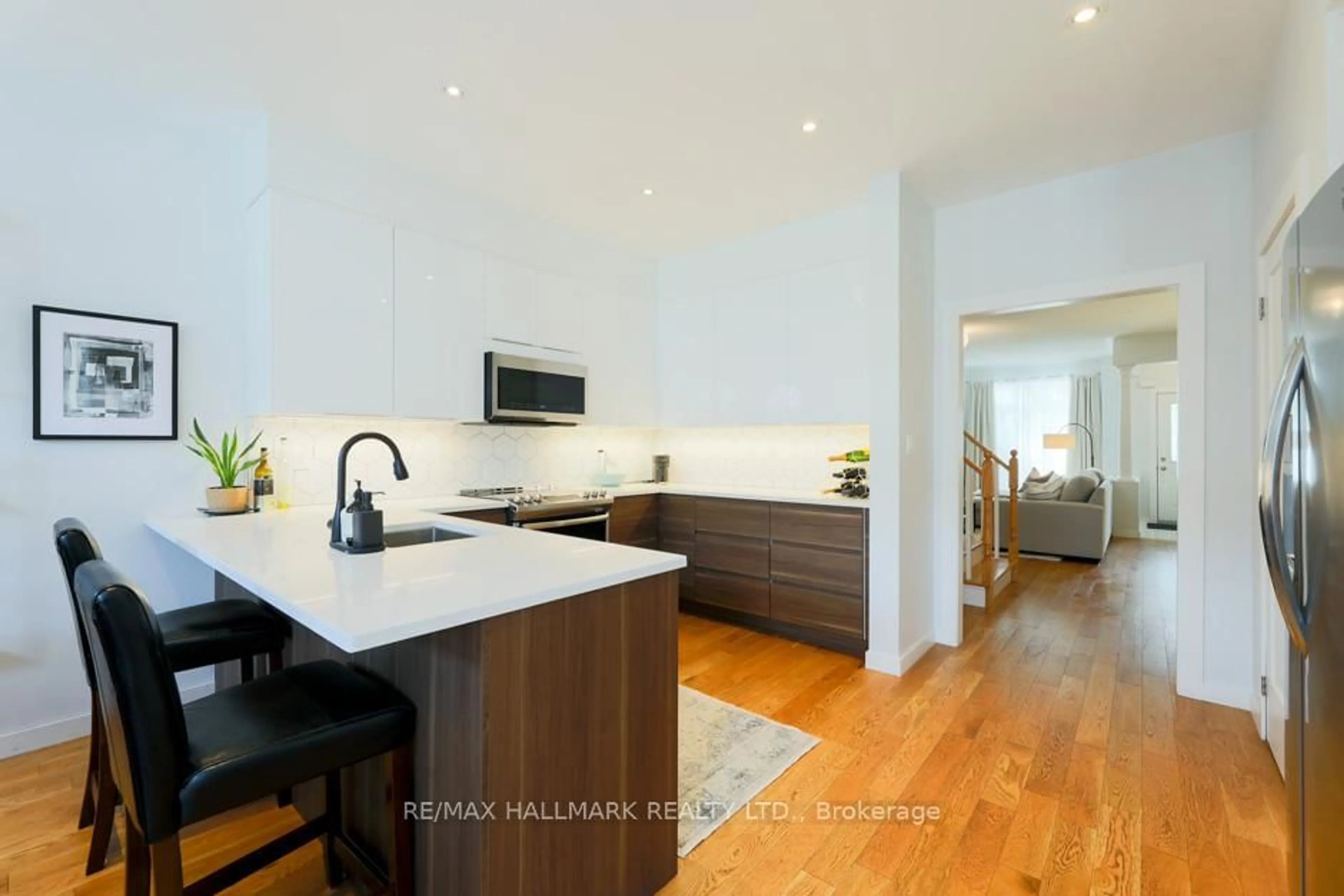 Open concept kitchen, wood/laminate floor for 80 Crossovers St, Toronto Ontario M4E 3X4