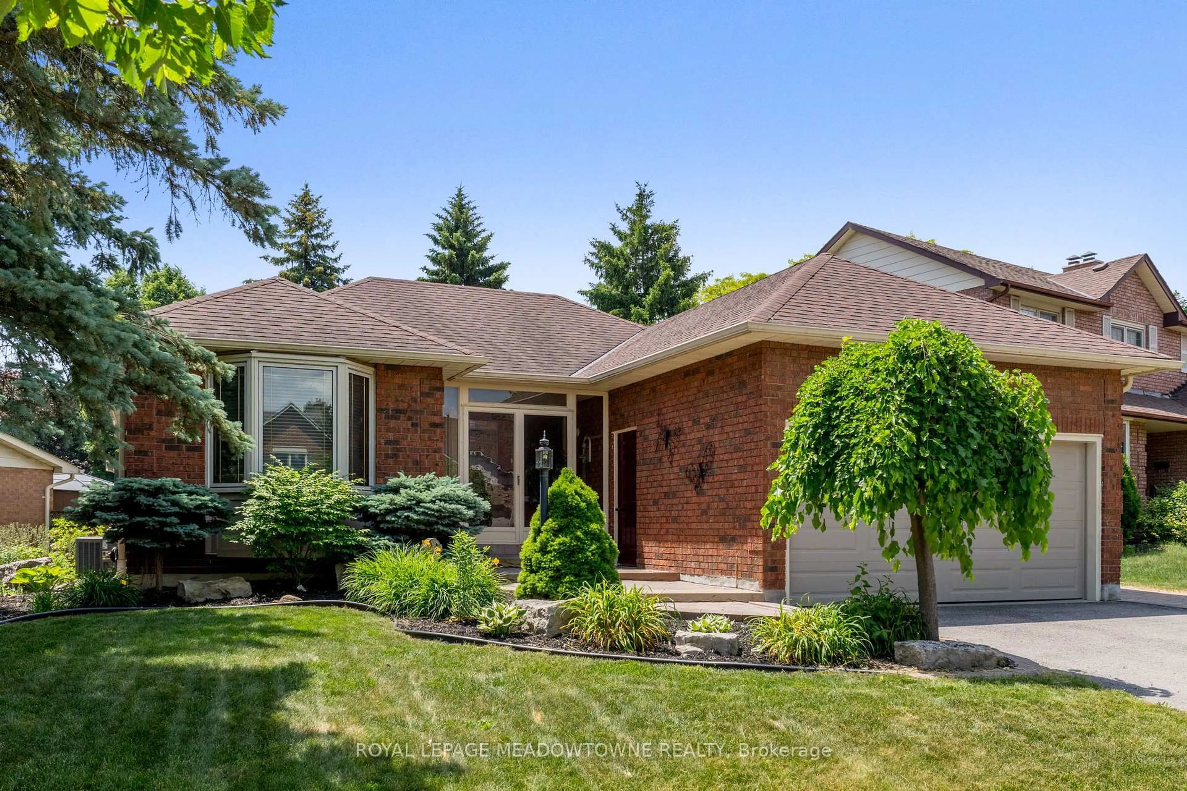 Home with brick exterior material, street for 52 Canadian Oaks Dr, Whitby Ontario L1N 6W8