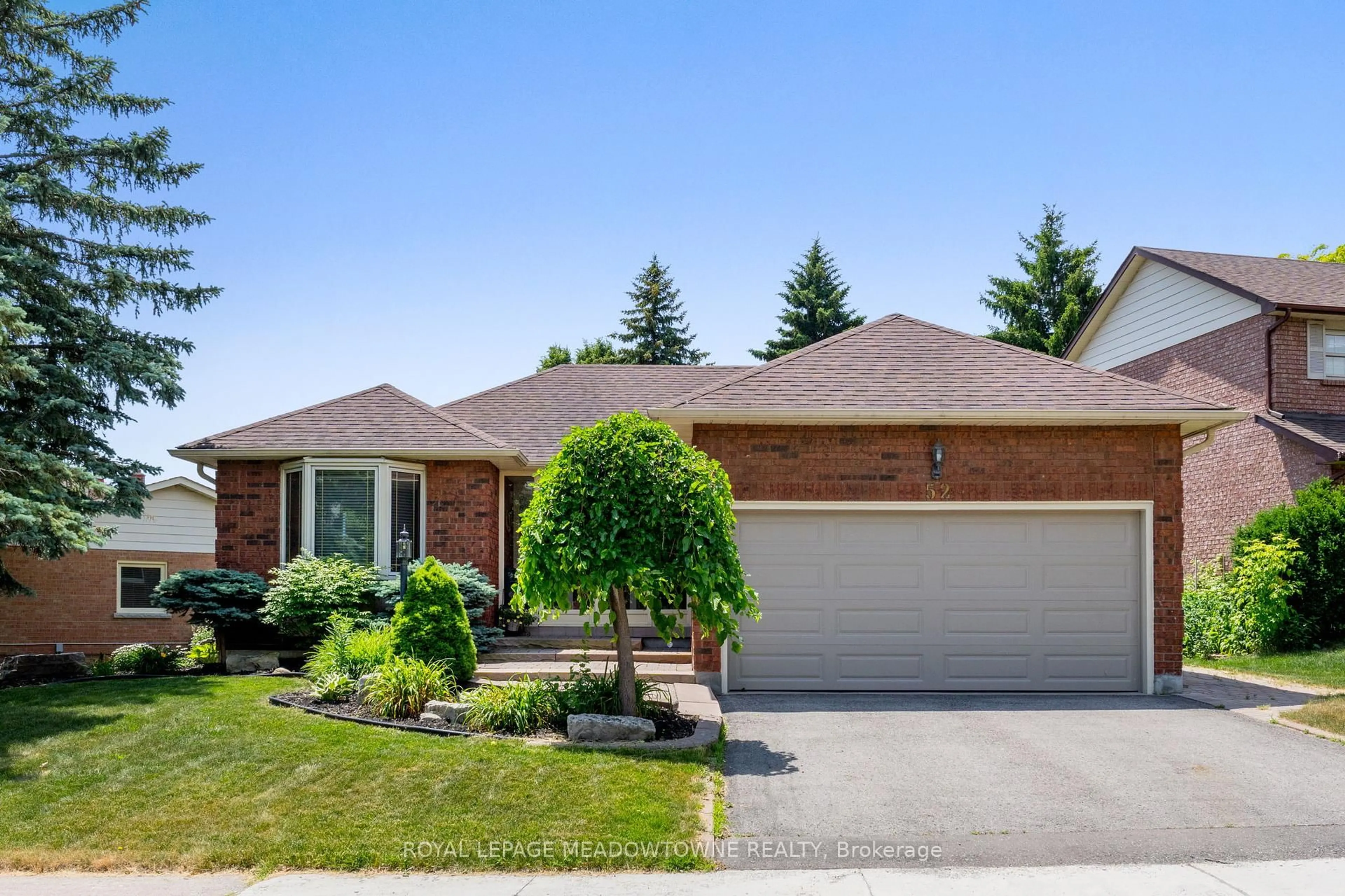 Home with brick exterior material, street for 52 Canadian Oaks Dr, Whitby Ontario L1N 6W8