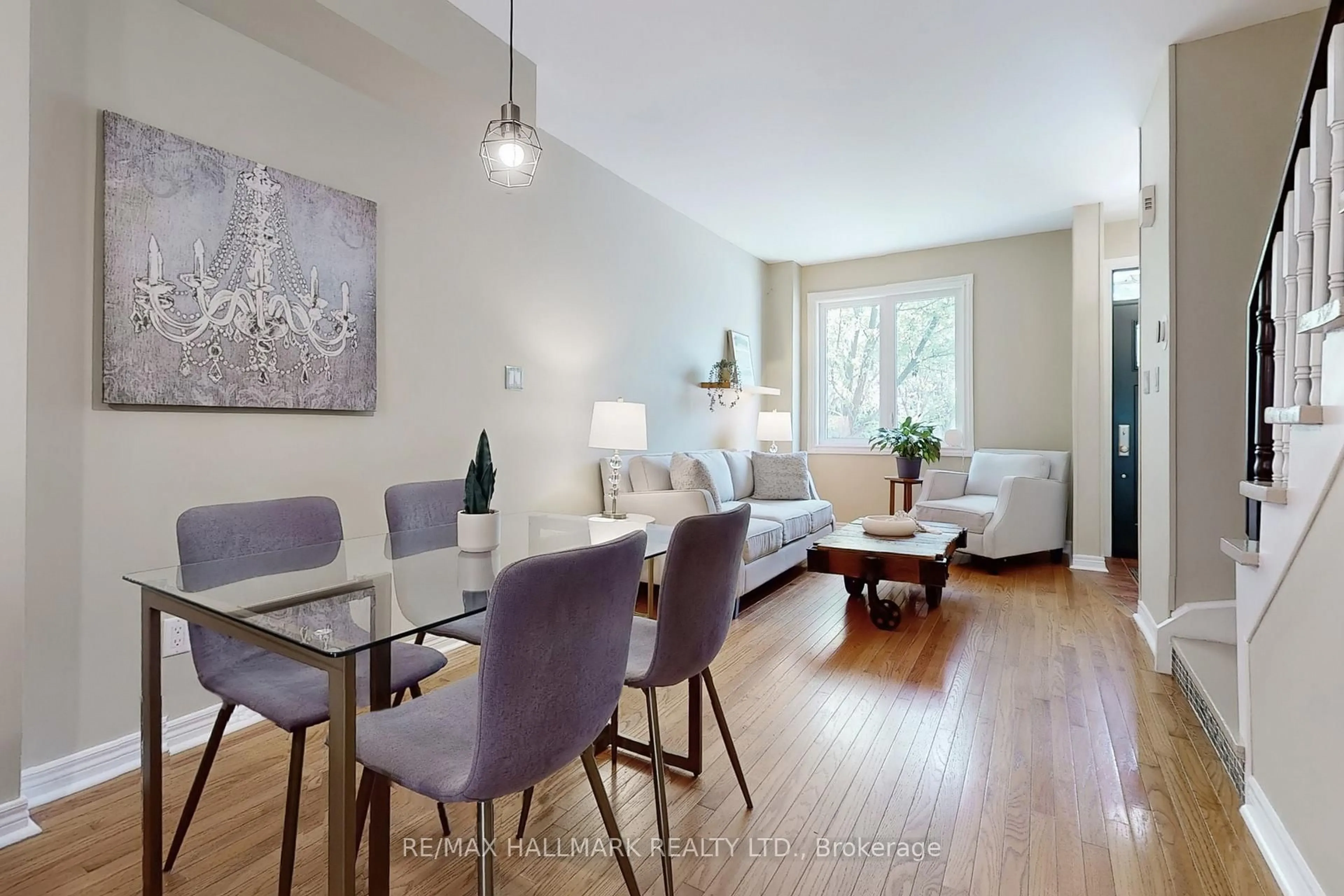 Living room with furniture, wood/laminate floor for 99 Goodwood Park Crt #12, Toronto Ontario M4C 5S9