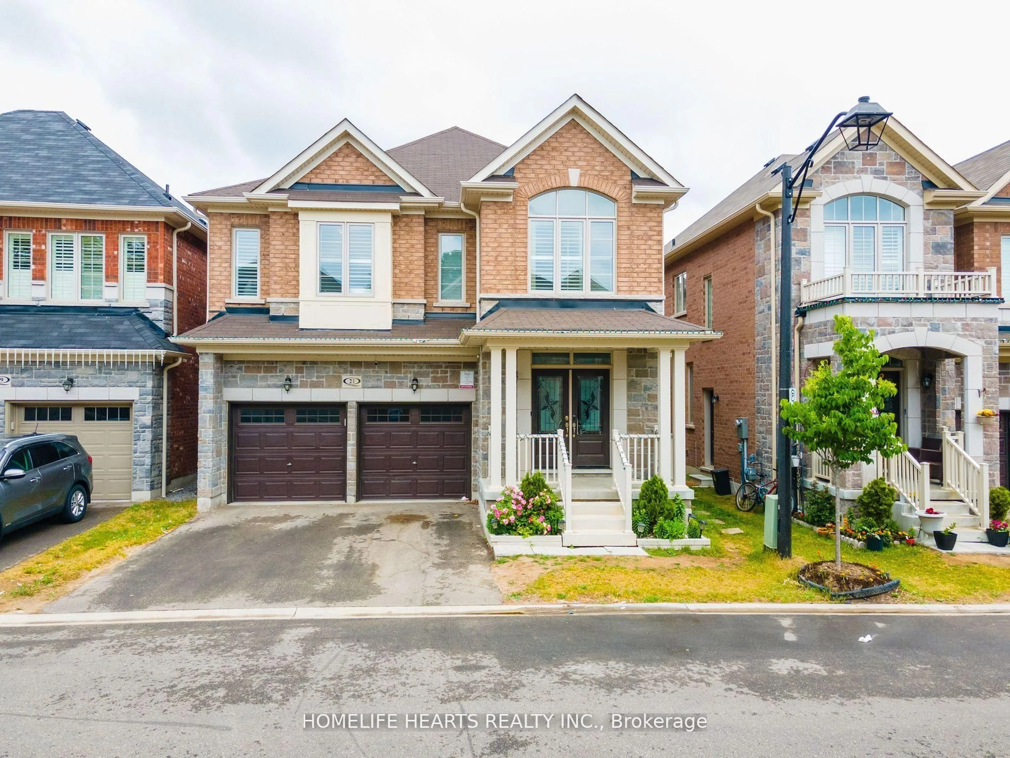 Home with brick exterior material, street for 21 Hassard Short Lane, Ajax Ontario L1S 0G4
