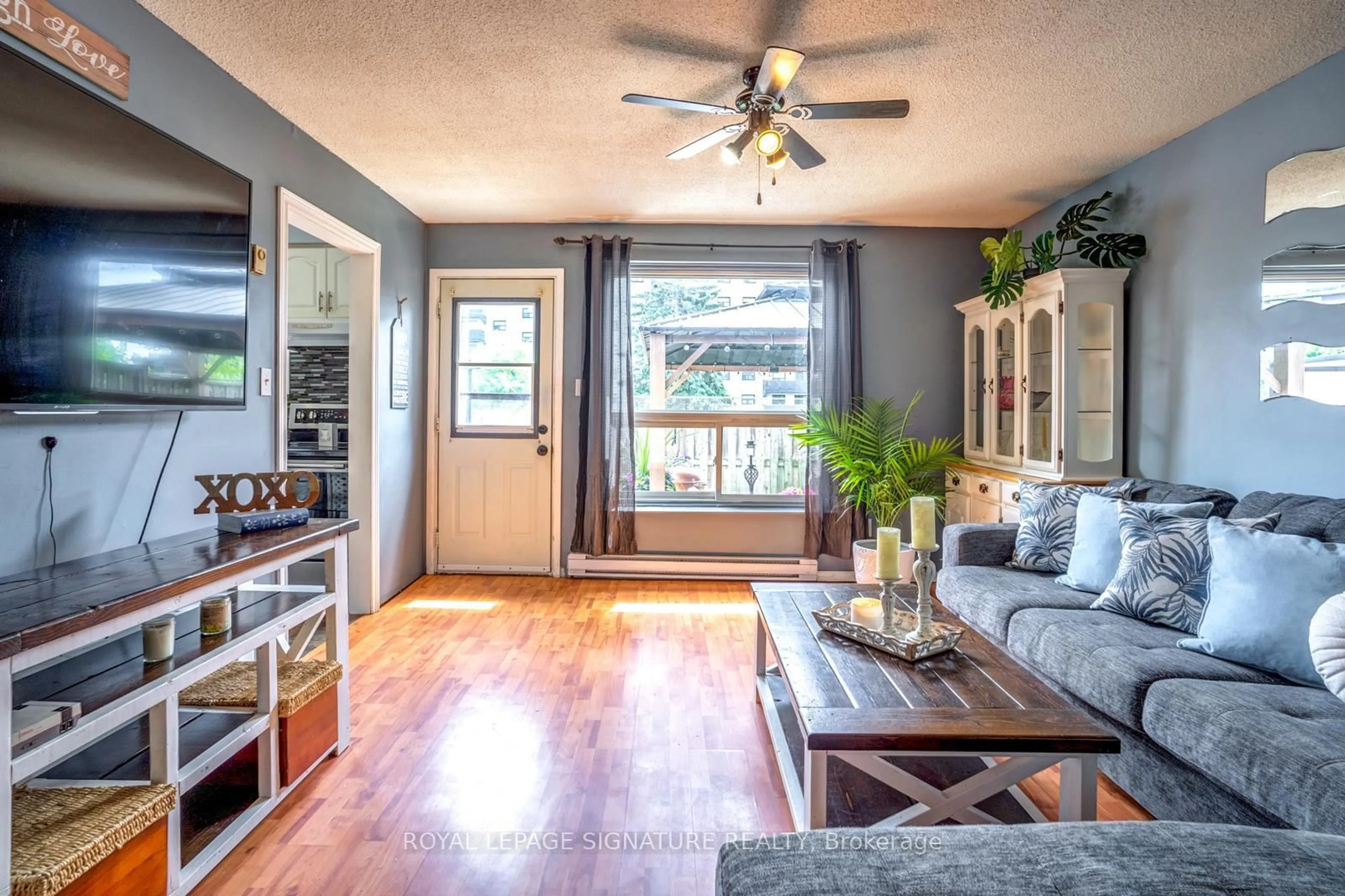 Living room with furniture, wood/laminate floor for 120 Nonquon Rd #44, Oshawa Ontario L1G 7E6