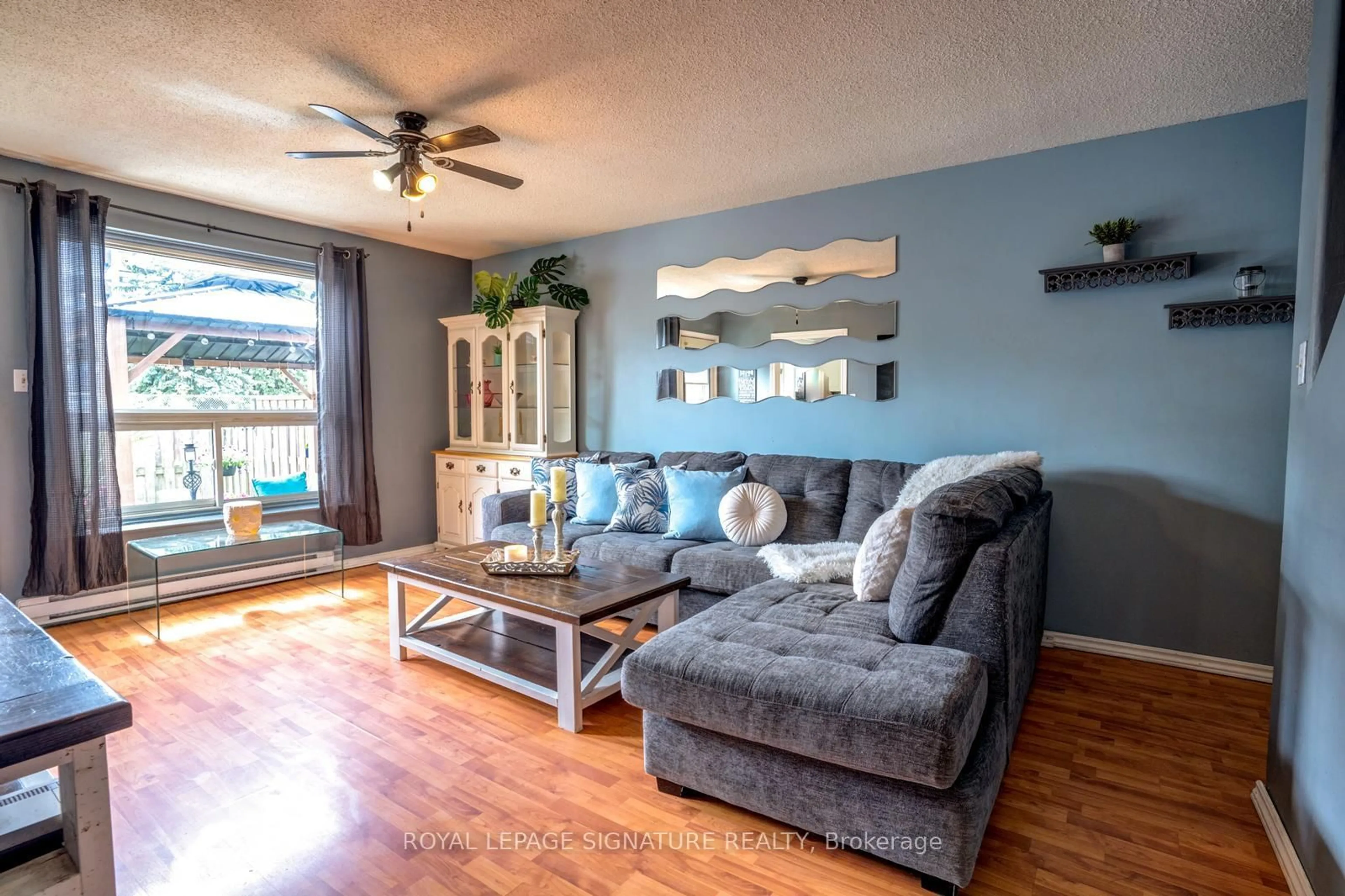 Living room with furniture, wood/laminate floor for 120 Nonquon Rd #44, Oshawa Ontario L1G 7E6