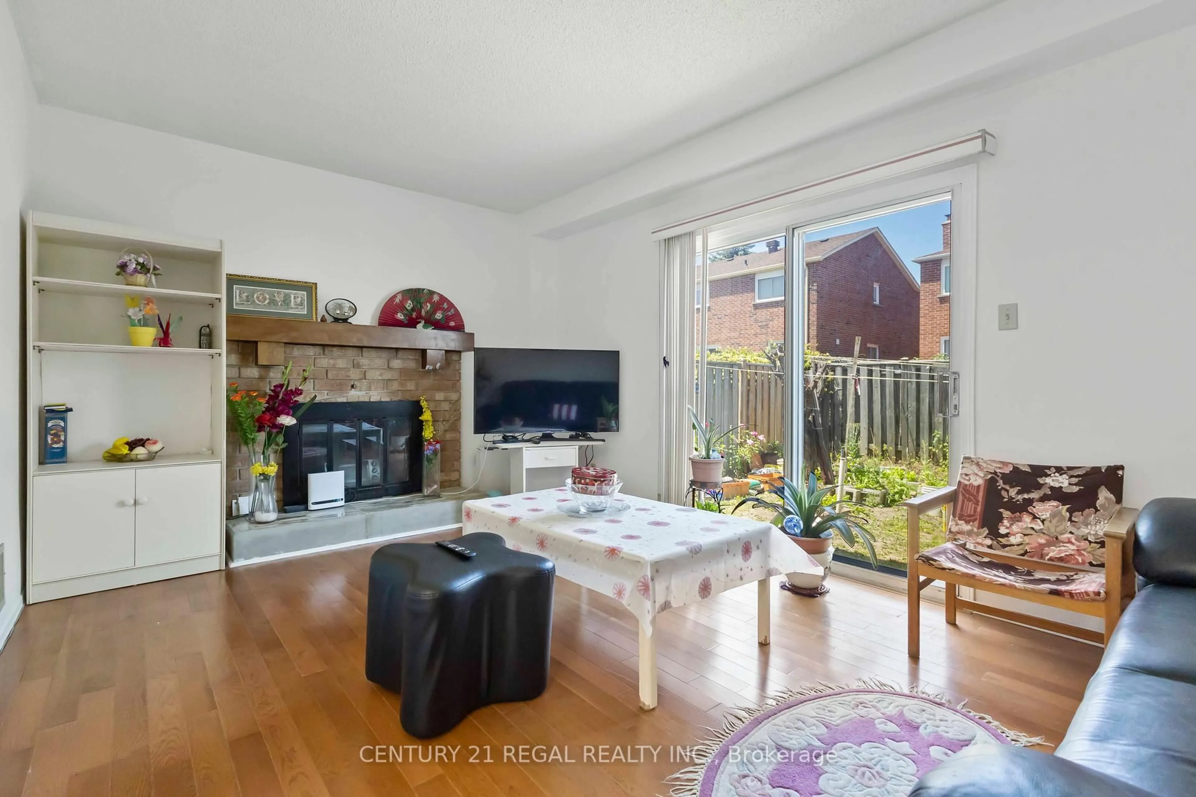 Living room with furniture, wood/laminate floor for 85 Nettlecreek Cres, Toronto Ontario M1V 4L2