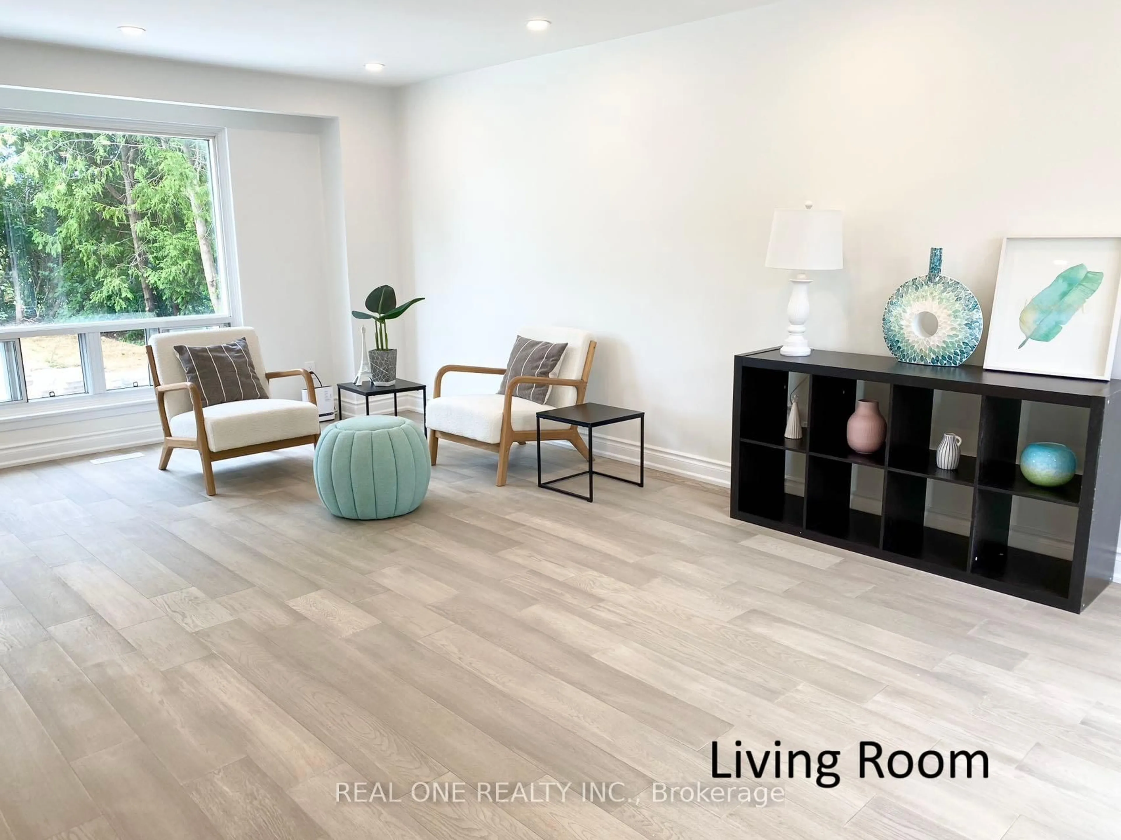 Living room with furniture, wood/laminate floor for 52 Staley Terr, Toronto Ontario M1W 2E7