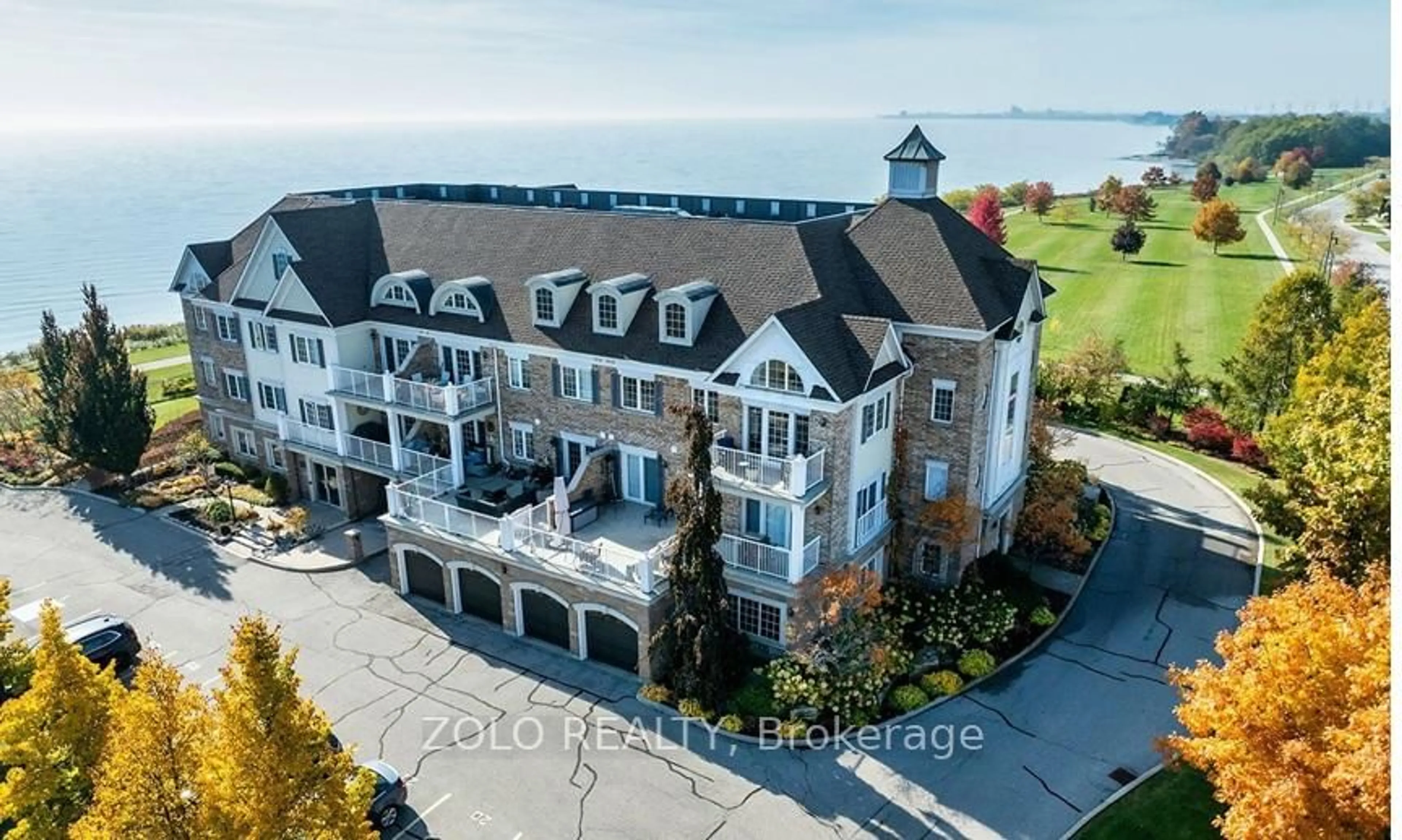 A pic from outside/outdoor area/front of a property/back of a property/a pic from drone, water/lake/river/ocean view for 395 Lakebreeze Dr #301, Clarington Ontario L1B 0A5
