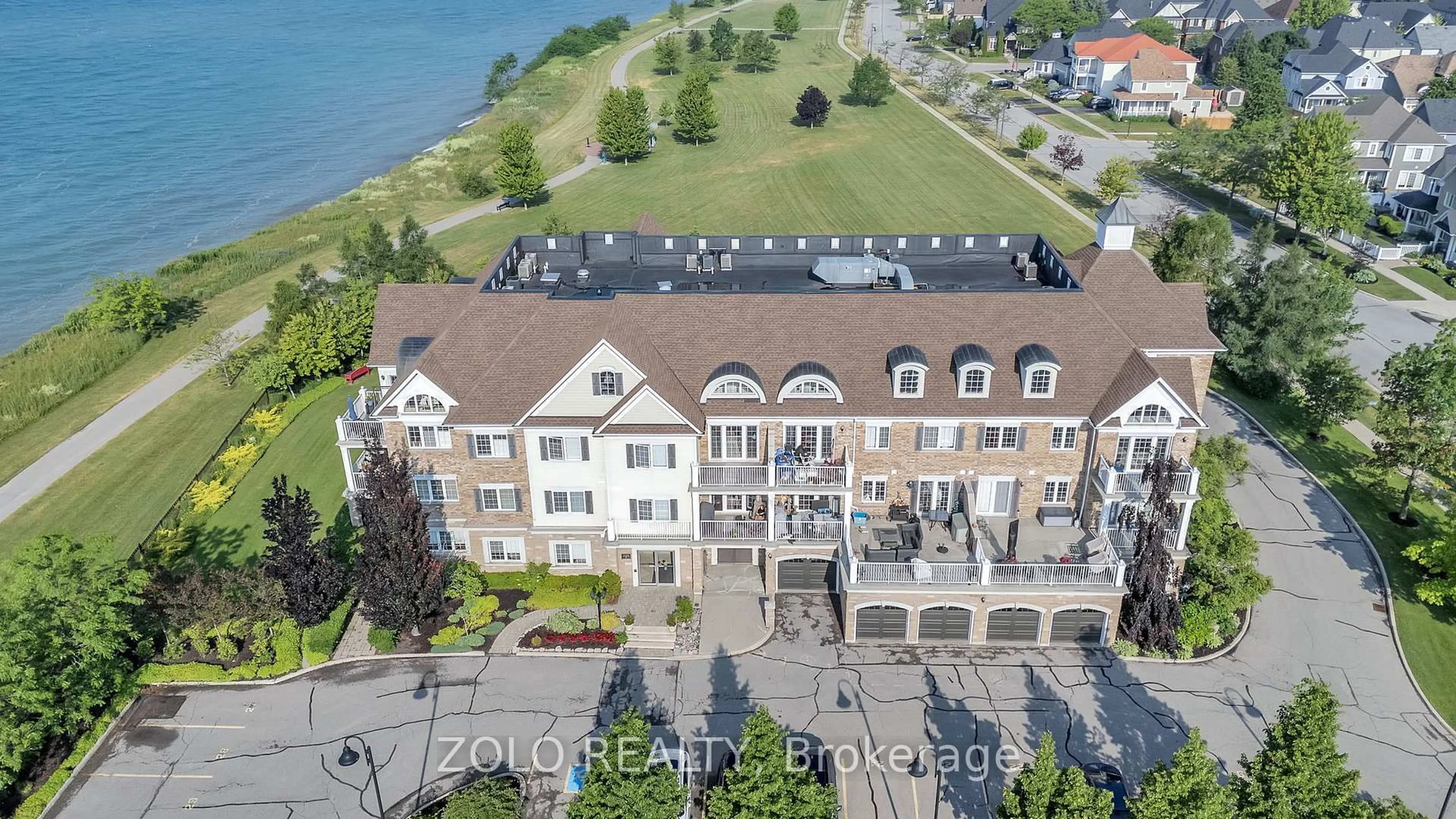 A pic from outside/outdoor area/front of a property/back of a property/a pic from drone, water/lake/river/ocean view for 395 Lakebreeze Dr #301, Clarington Ontario L1B 0A5