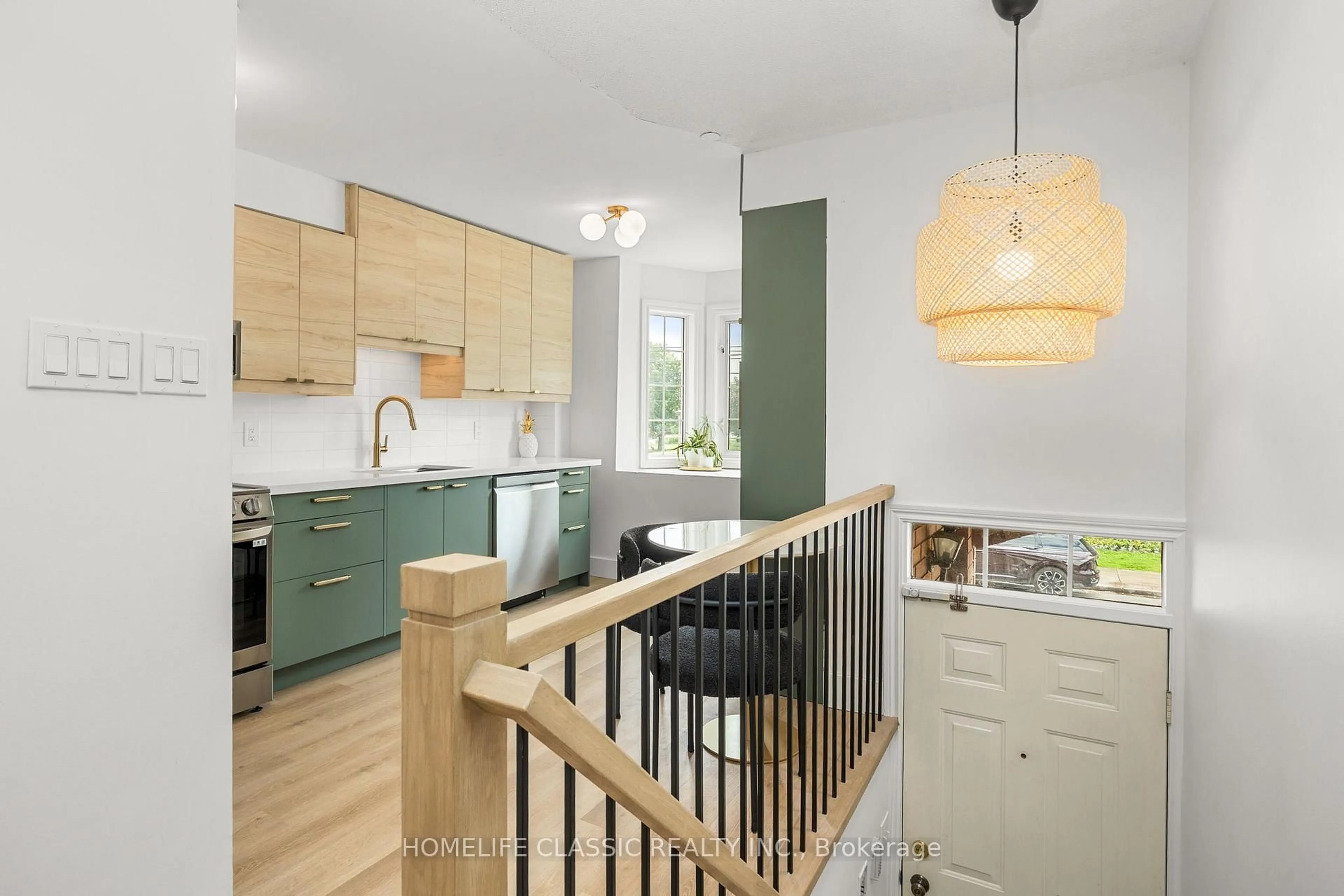 Open concept kitchen, wood/laminate floor for 1508 Queen St, Toronto Ontario M4L 1E3