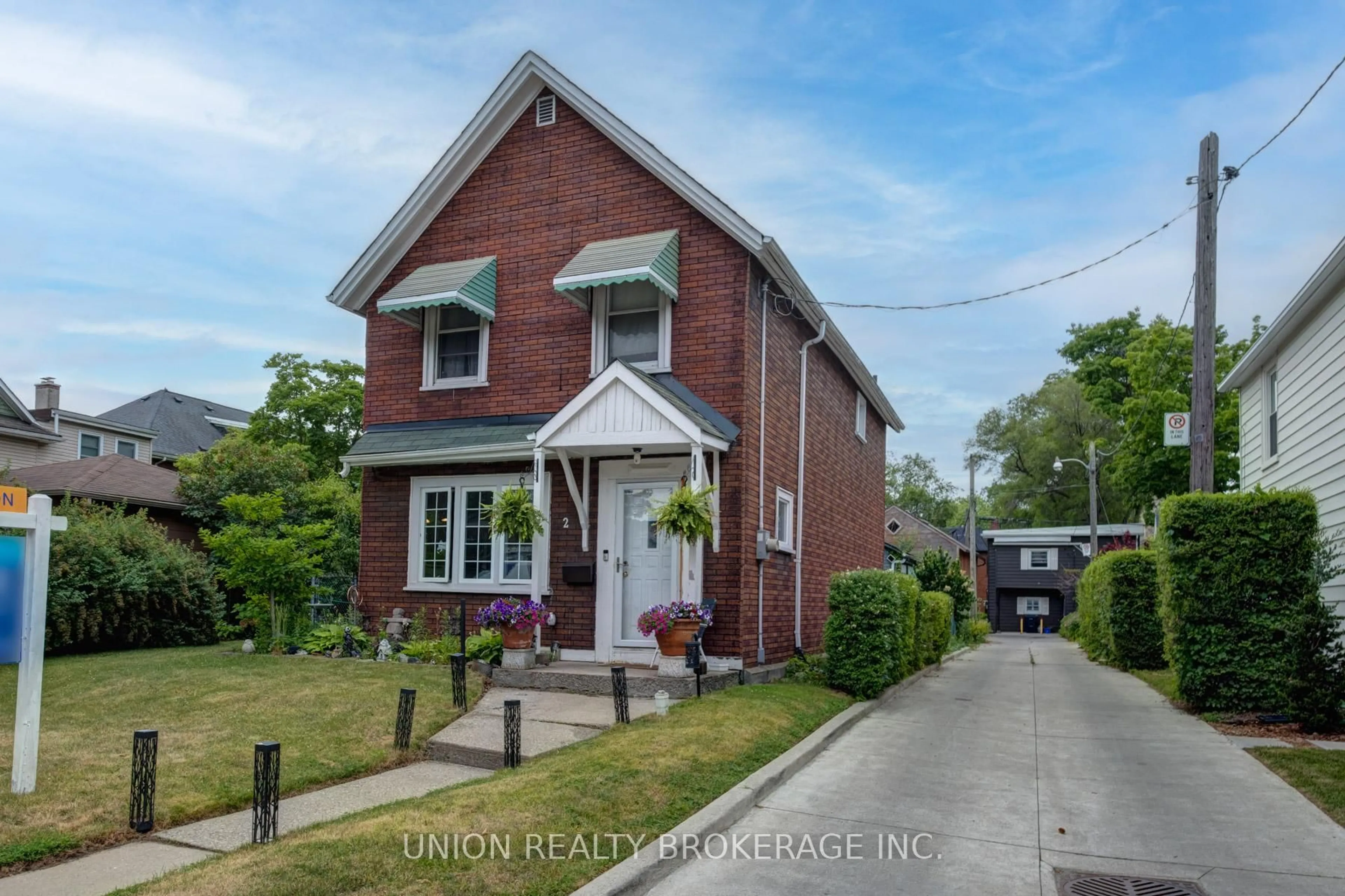 Home with brick exterior material, street for 2 Kimberley Ave, Toronto Ontario M4E 2Z2