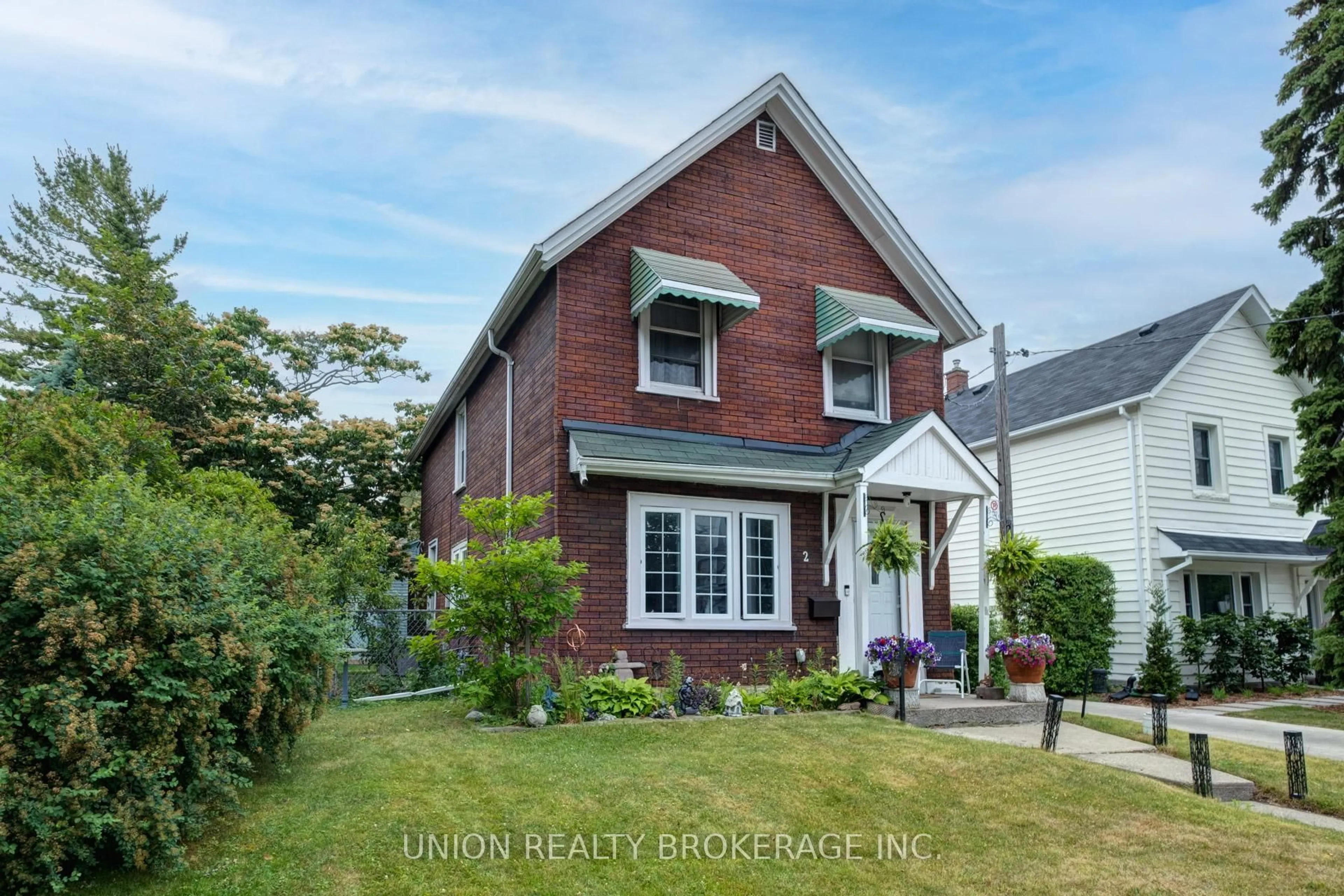 Home with brick exterior material, street for 2 Kimberley Ave, Toronto Ontario M4E 2Z2