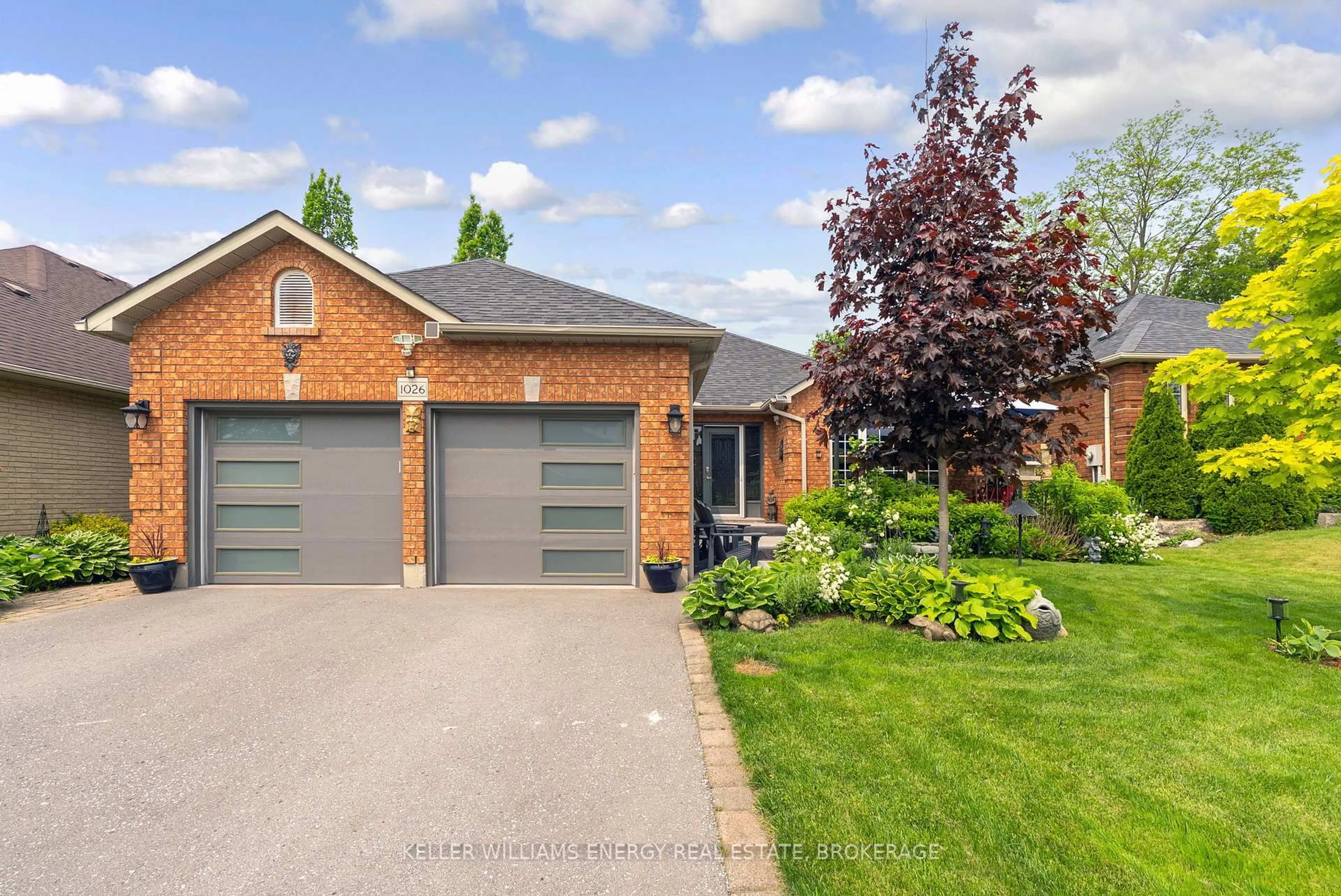 Home with brick exterior material, street for 1026 Stone Cottage Cres, Oshawa Ontario L1K 1Z5