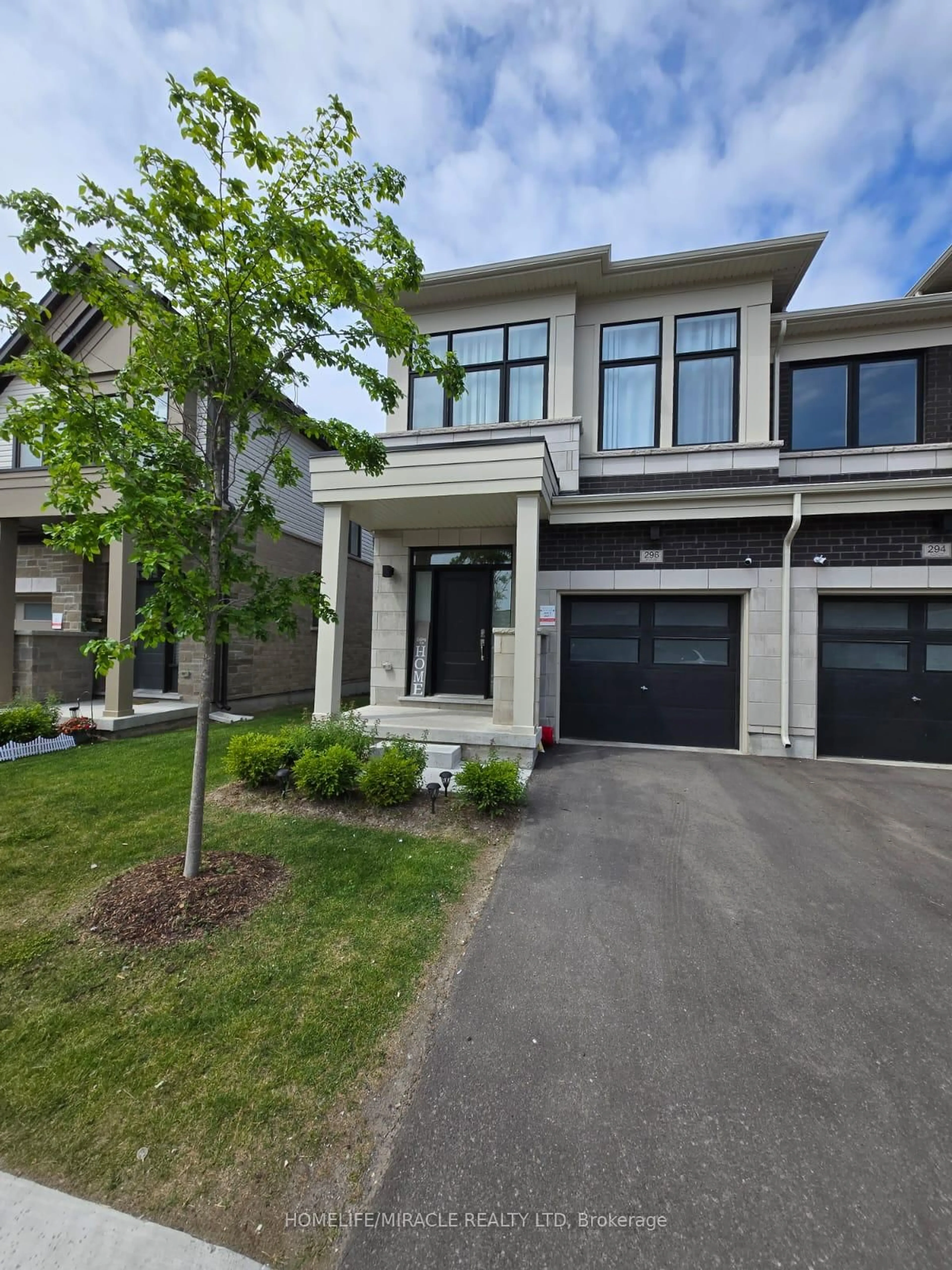 Home with brick exterior material, street for 296 Okanagan Path, Oshawa Ontario L1H 0A7