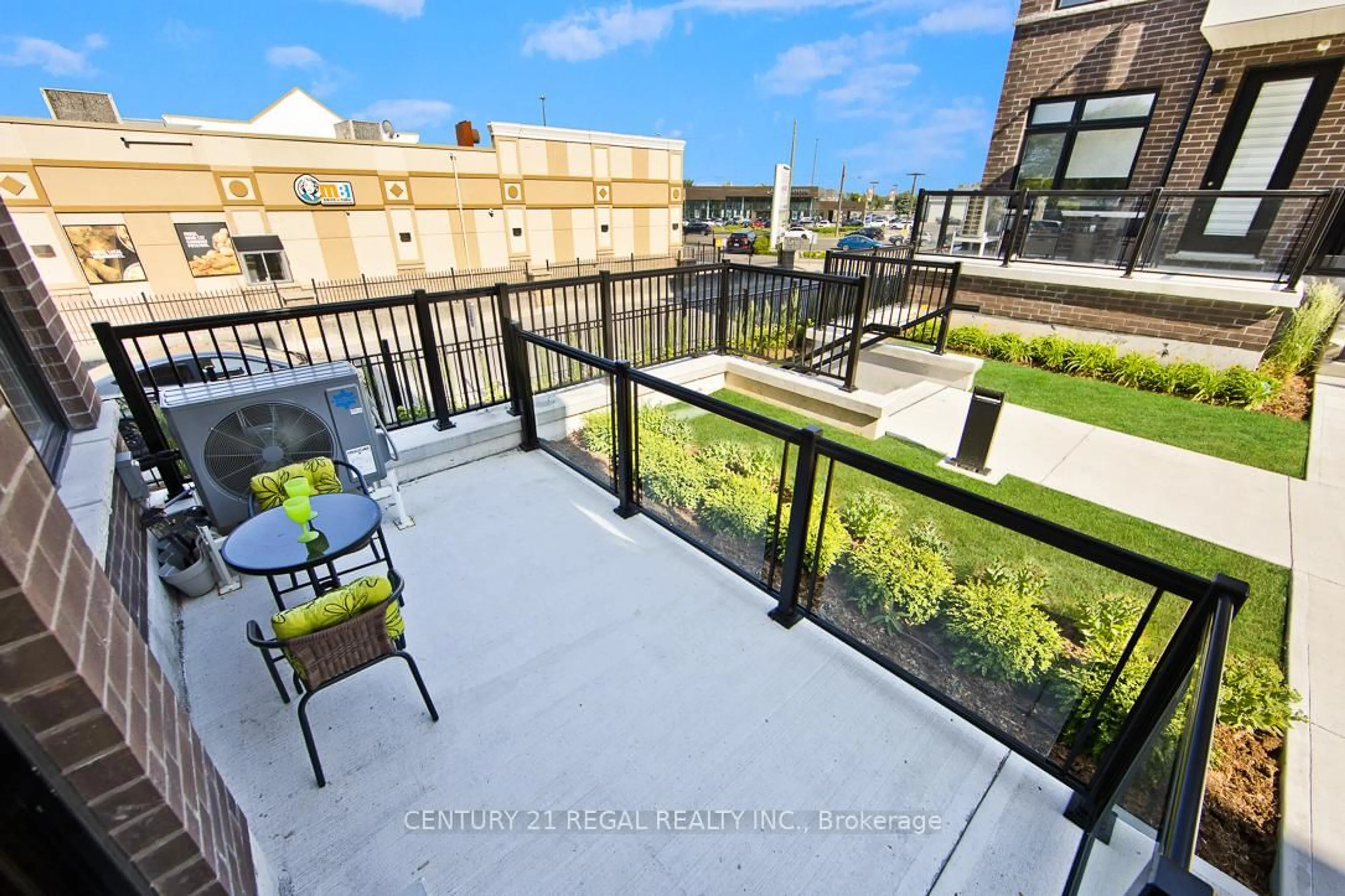 Patio, city buildings view from balcony for 755 Omega Dr #115, Pickering Ontario L1V 0H1