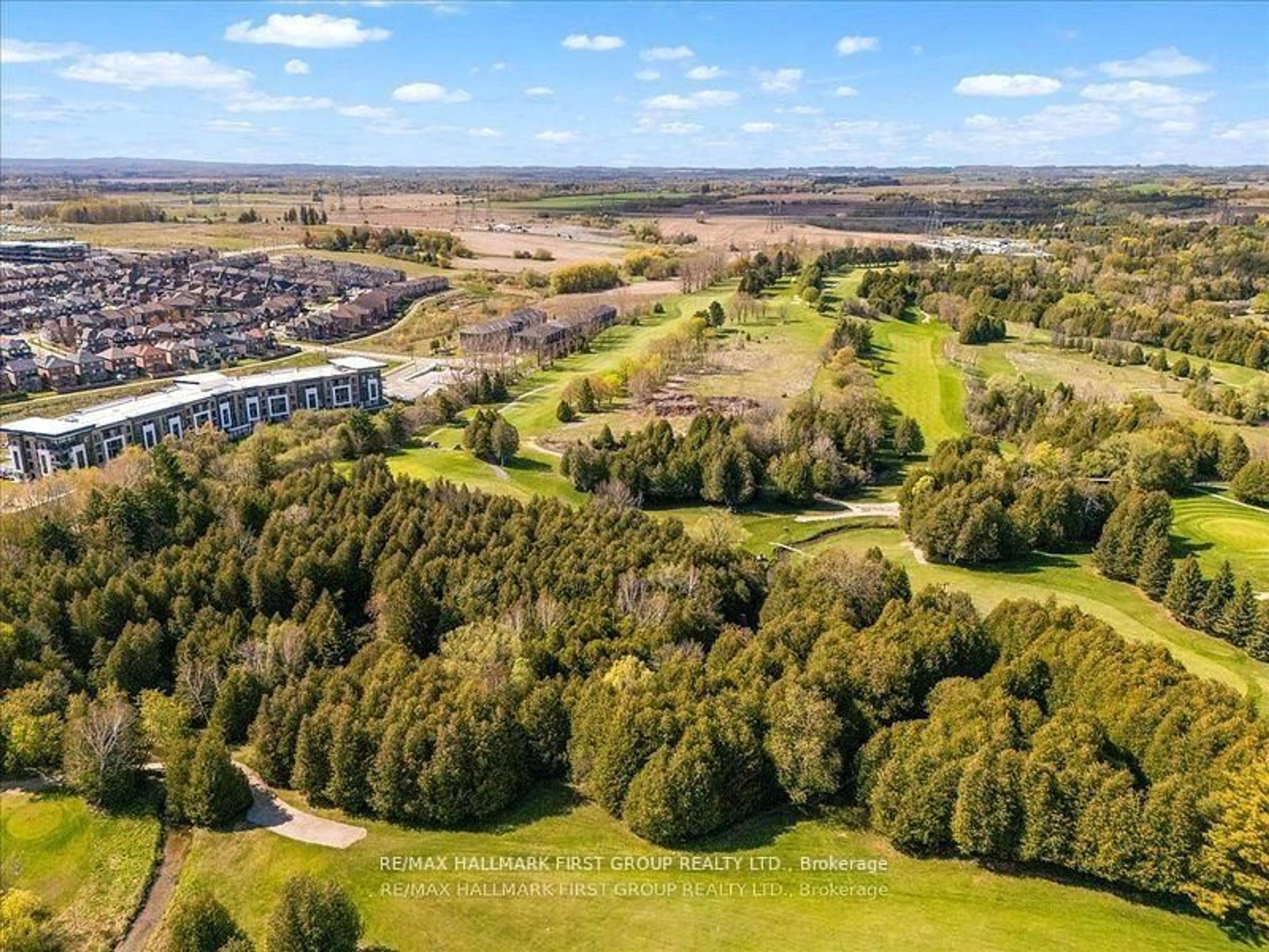 A pic from outside/outdoor area/front of a property/back of a property/a pic from drone, forest/trees view for 385 Arctic Red Dr #409, Oshawa Ontario L1L 0W9