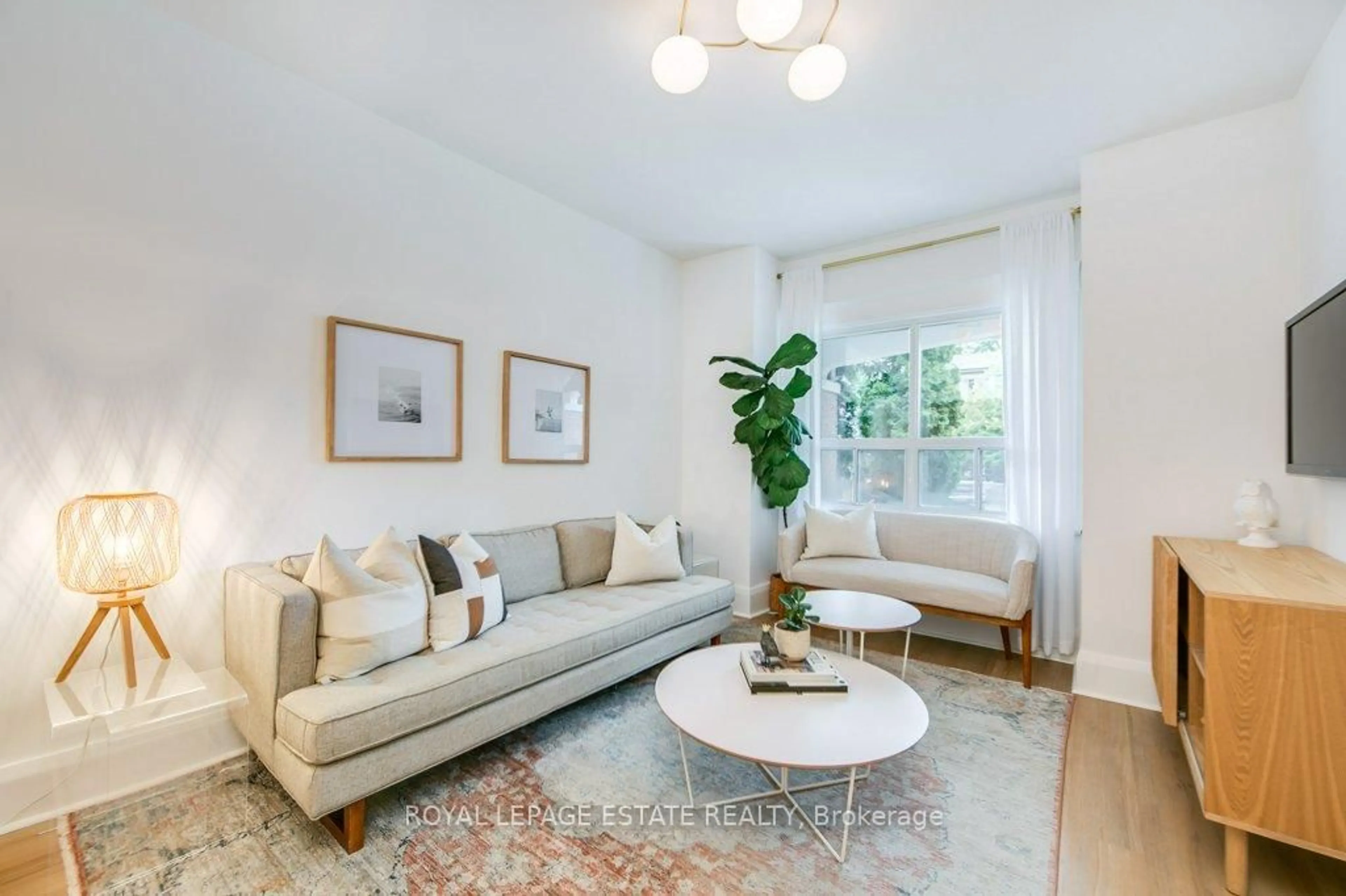 Living room with furniture, unknown for 130 Swanwick Ave, Toronto Ontario M4E 2A1