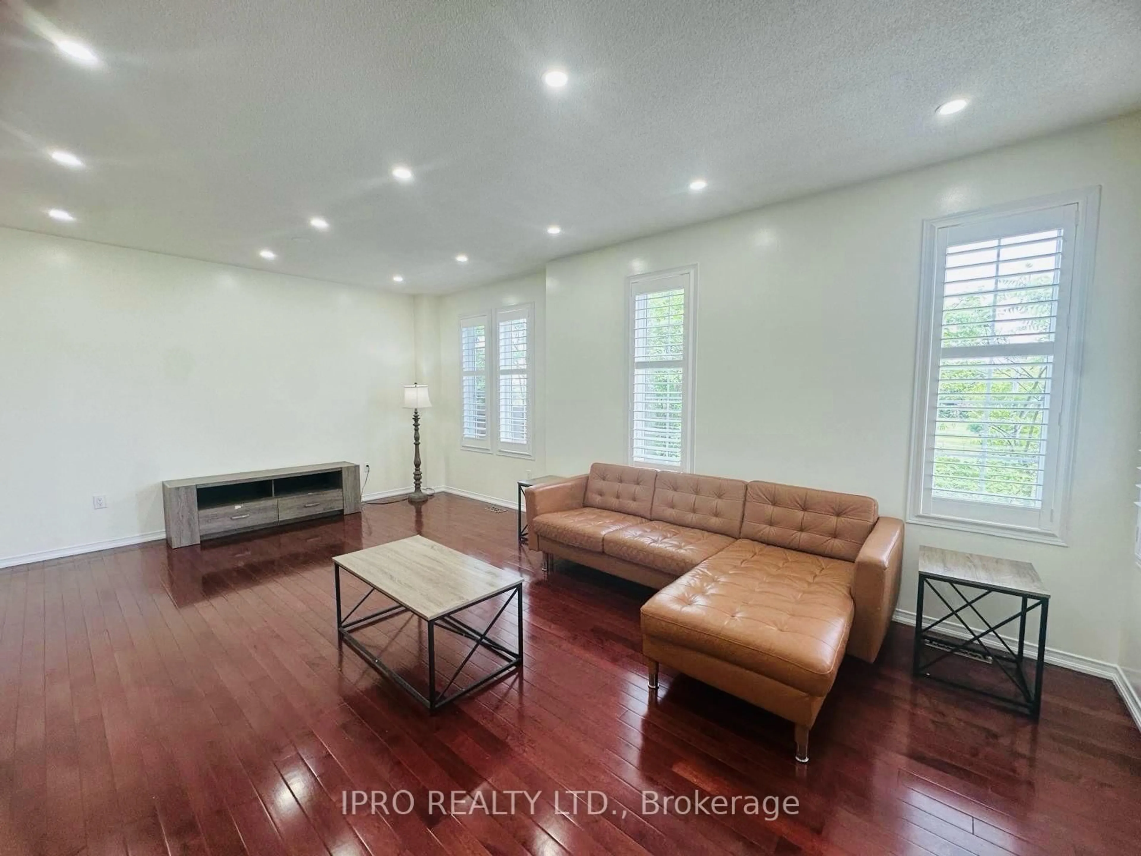 Living room with furniture, wood/laminate floor for 1773 Badgley Dr Dr, Oshawa Ontario L1K 0H5