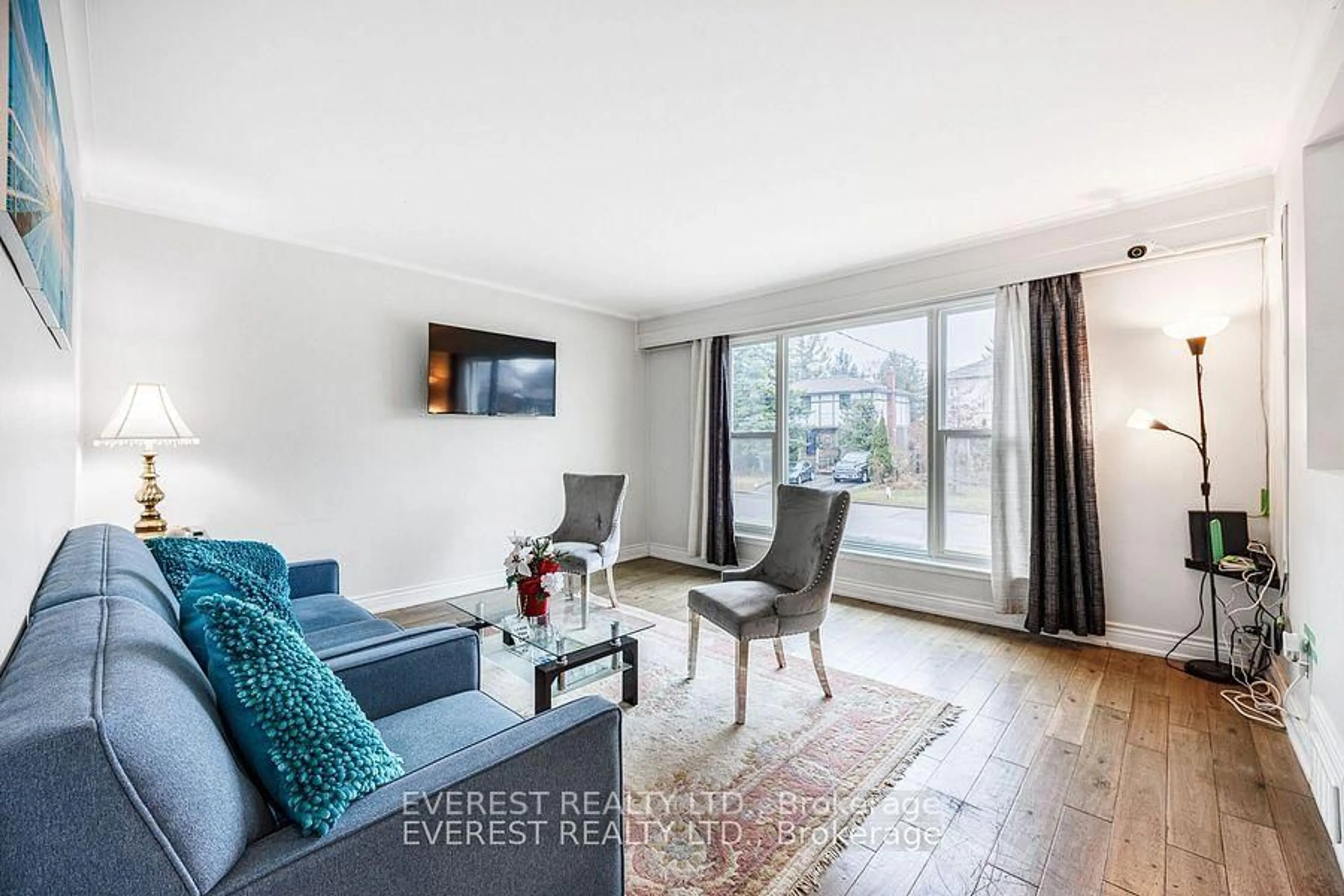 Living room with furniture, wood/laminate floor for 91 Hart Ave, Toronto Ontario M1K 3H3