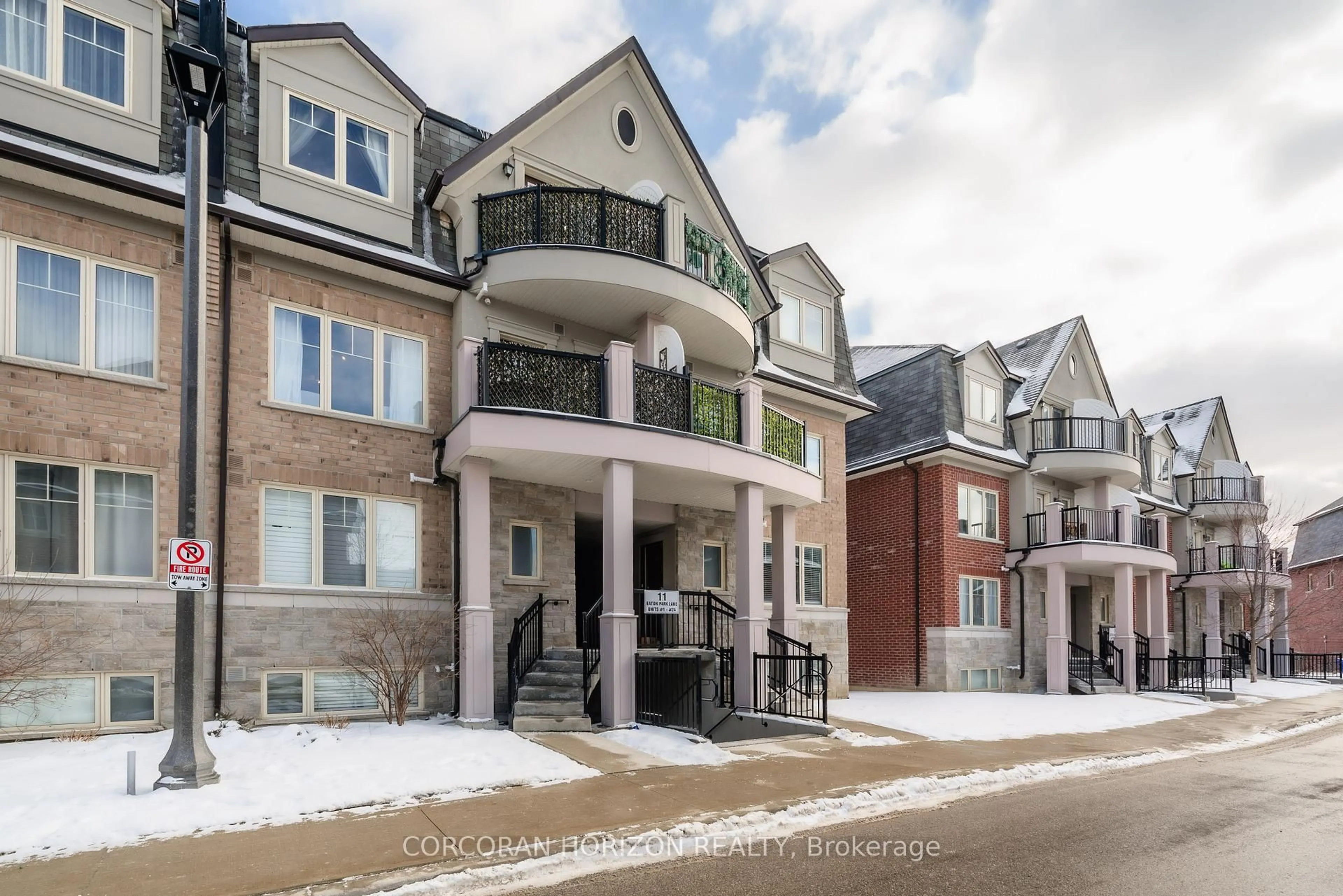 Home with brick exterior material, street for 11 Eaton Park Lane #19, Toronto Ontario M1W 0A5