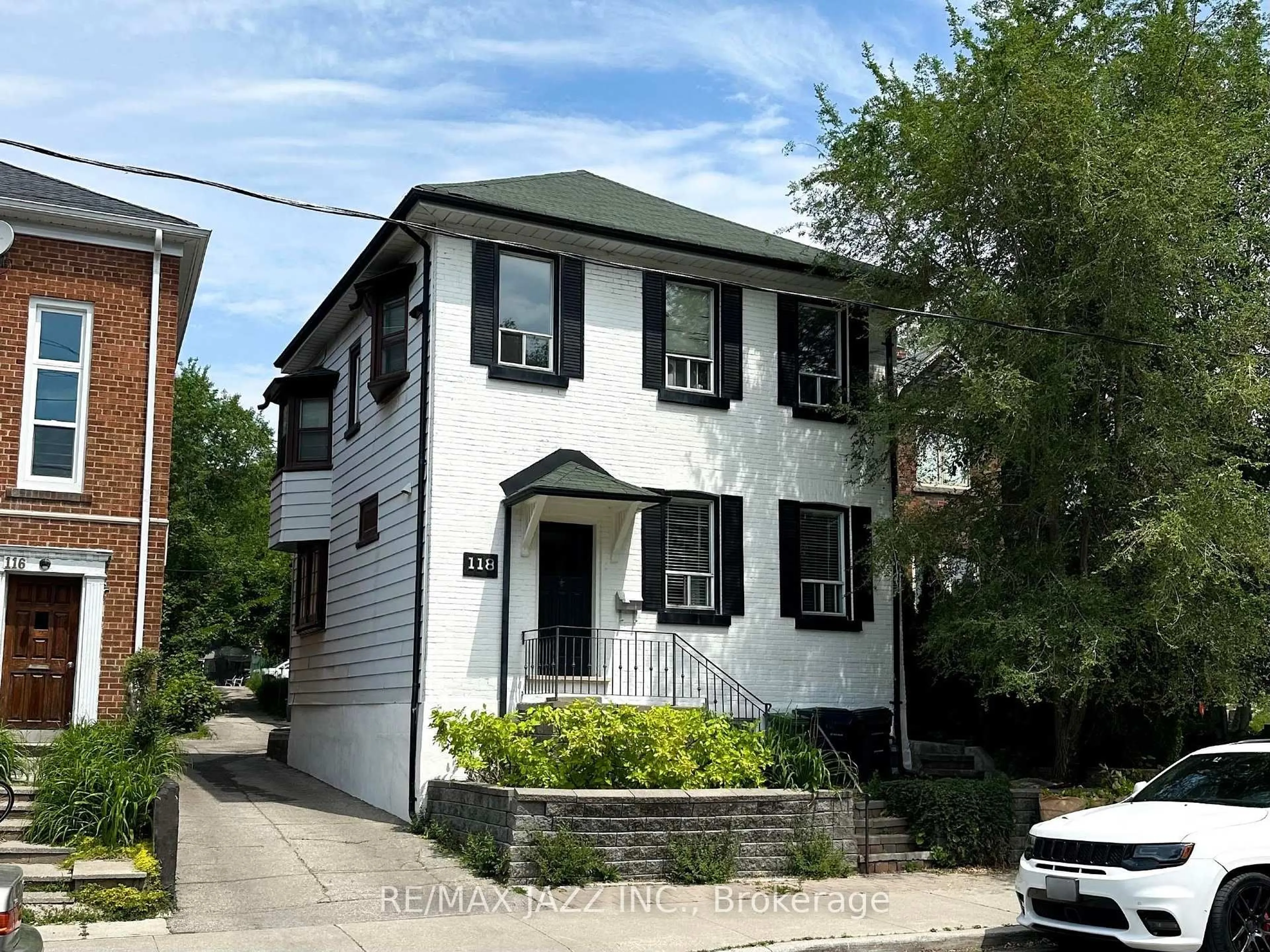 Home with brick exterior material, street for 118 Eastwood Rd, Toronto Ontario M4L 2C9