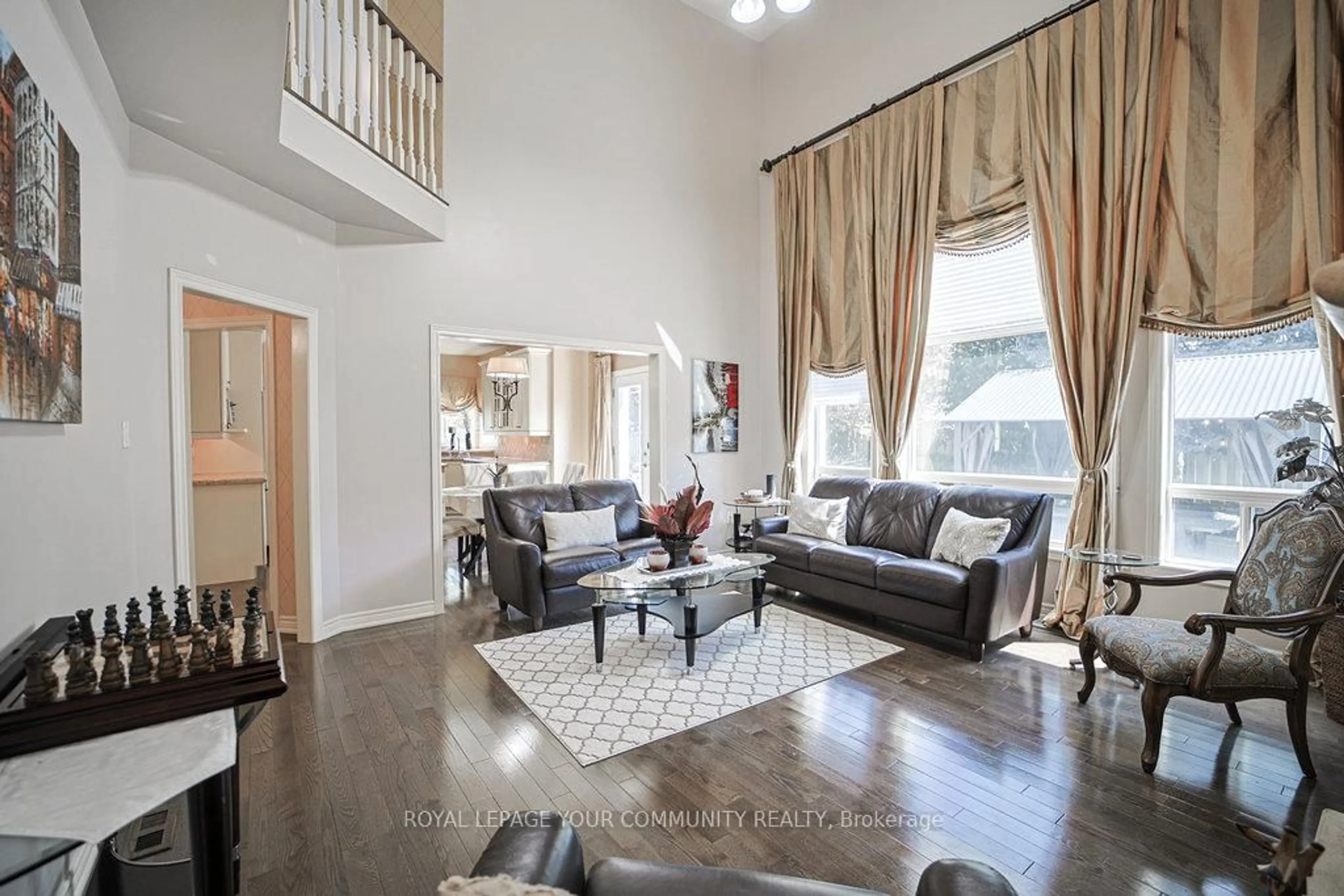 Living room with furniture, wood/laminate floor for 17 Sturgess Cres, Whitby Ontario L1M 1J9