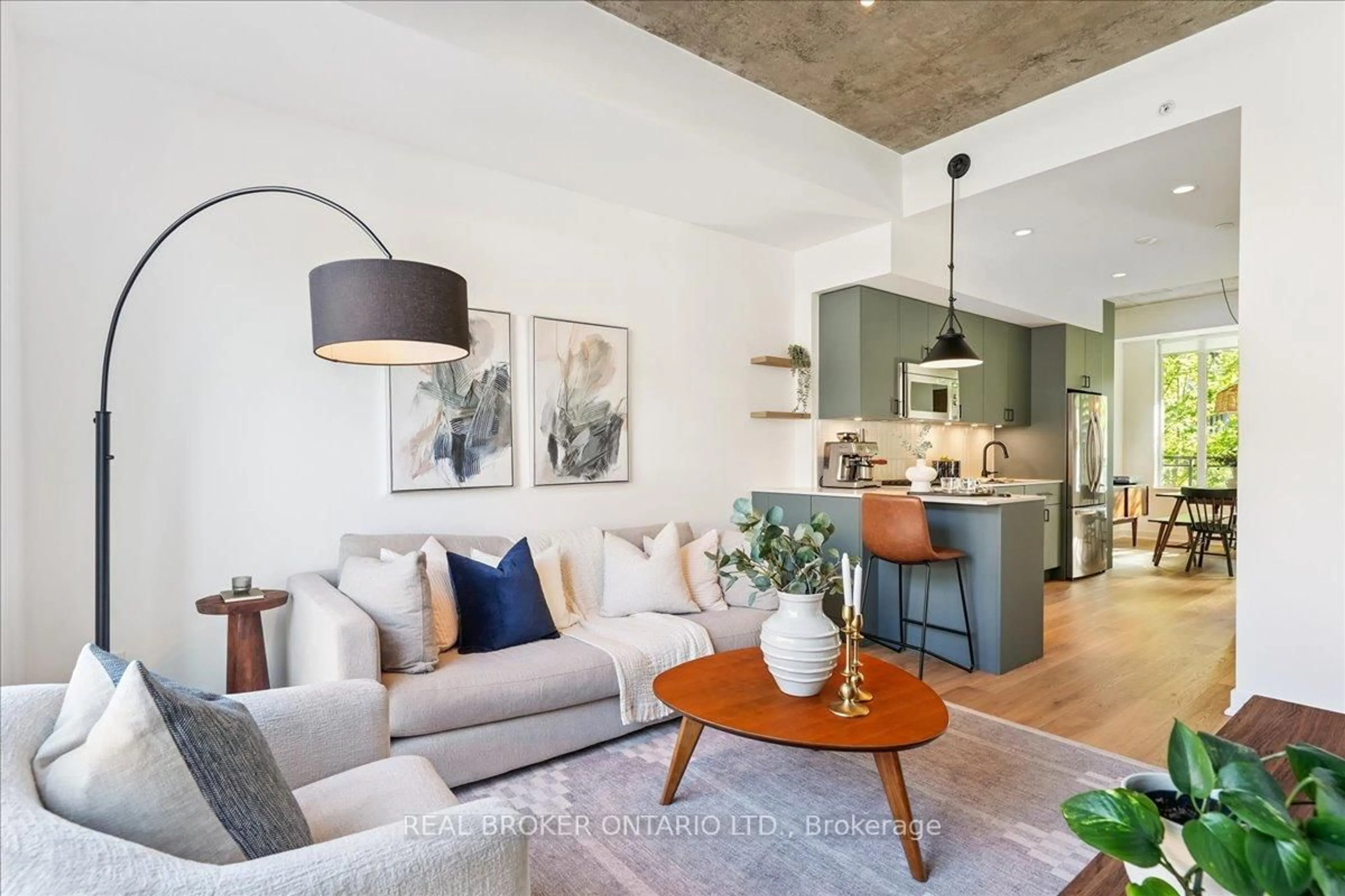 Living room with furniture, cement floor for 1190 Dundas St #335, Toronto Ontario M4M 0C5