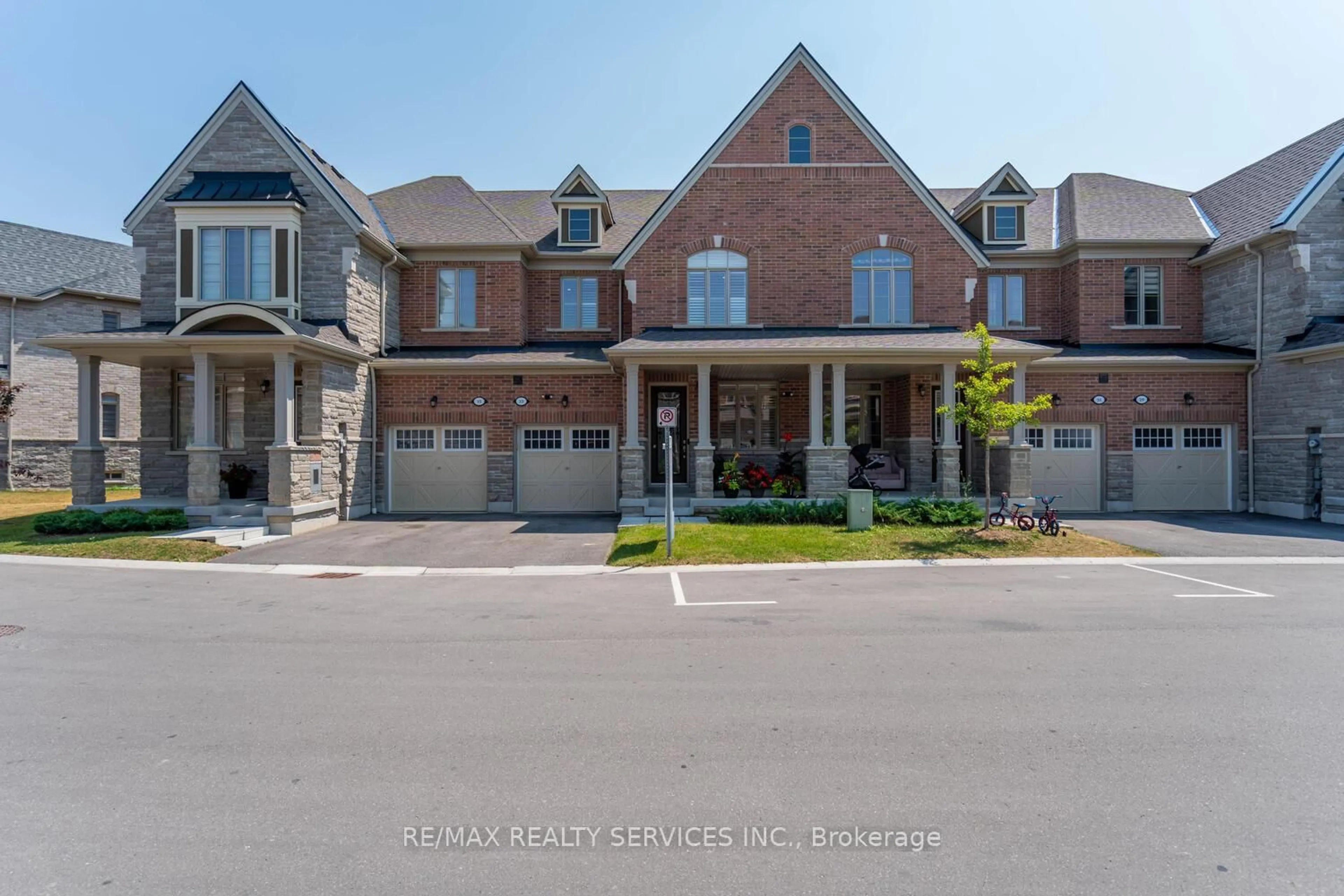 Home with brick exterior material, street for 33 Hickling Lane, Ajax Ontario L1T 0P9