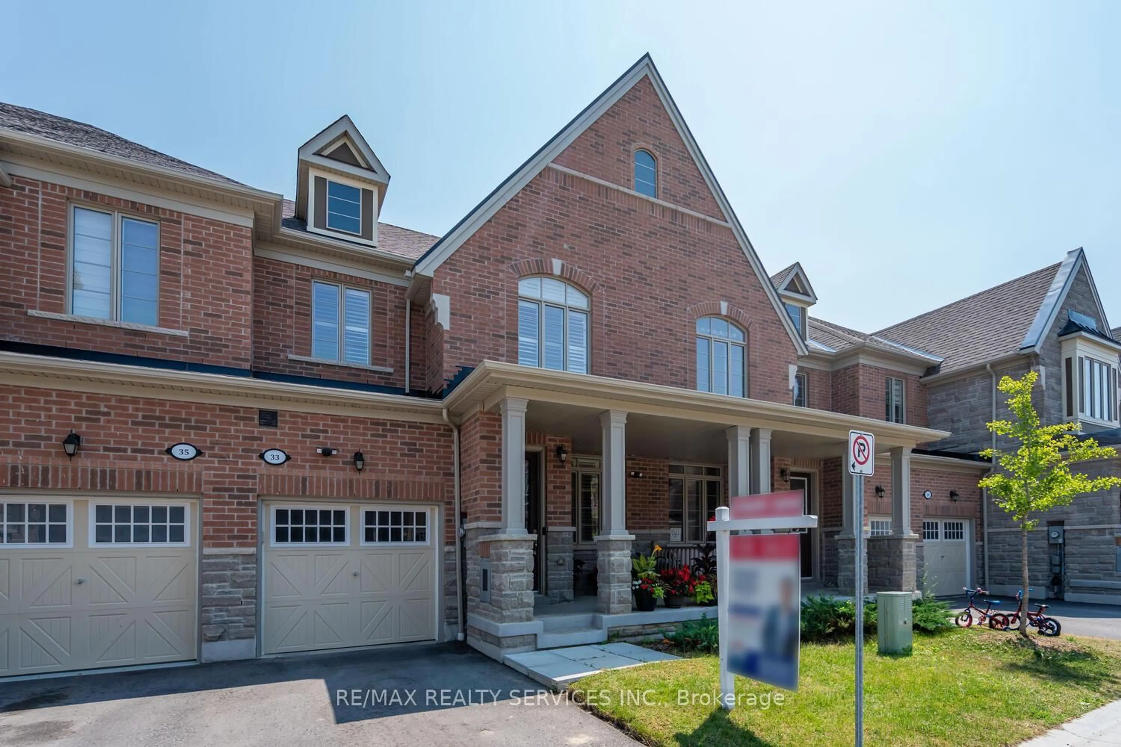 Home with brick exterior material, street for 33 Hickling Lane, Ajax Ontario L1T 0P9