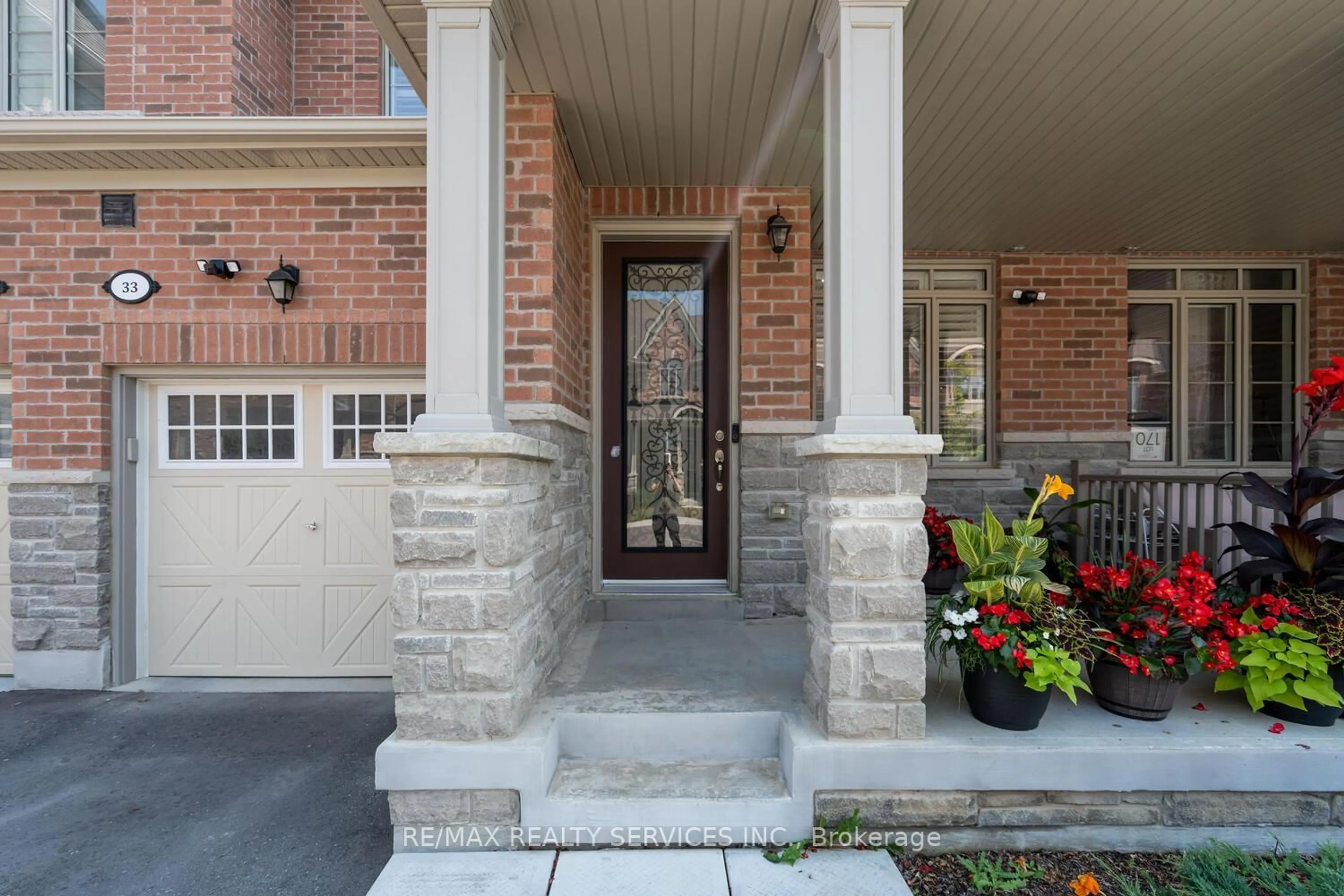 Home with brick exterior material, street for 33 Hickling Lane, Ajax Ontario L1T 0P9