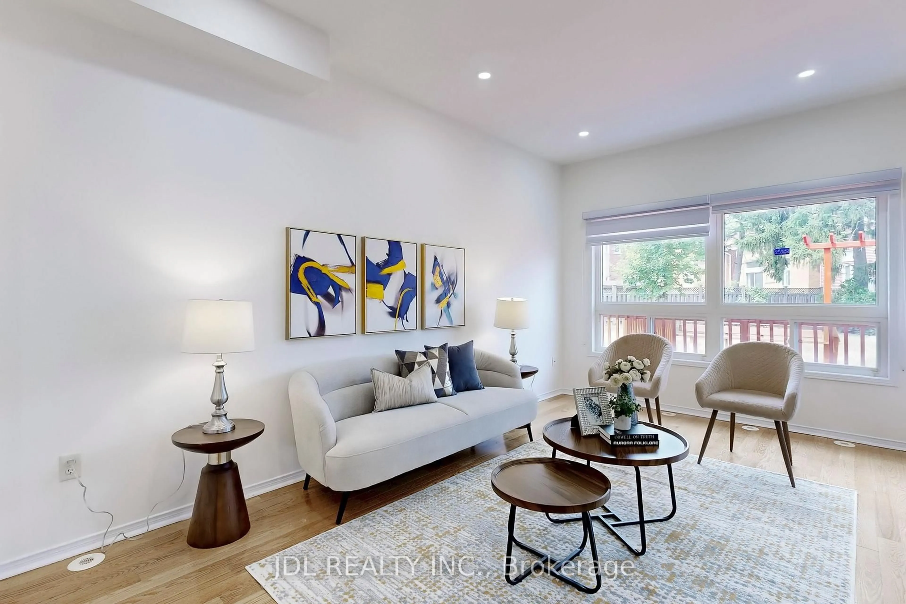 Living room with furniture, wood/laminate floor for 52 Wyper Sq, Toronto Ontario M1S 0B3