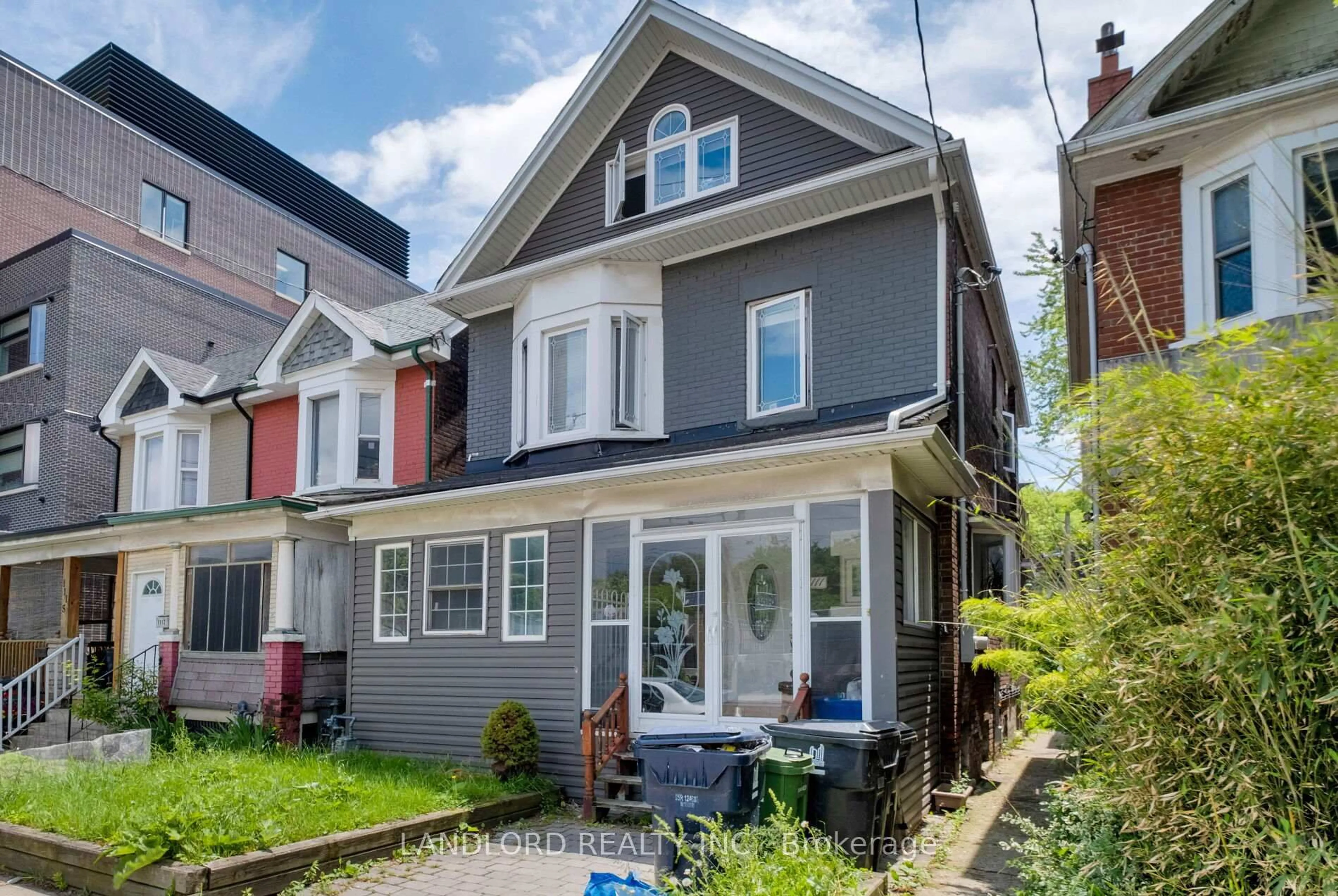 Home with vinyl exterior material, street for 1111 Gerrard St, Toronto Ontario M4M 1Z9