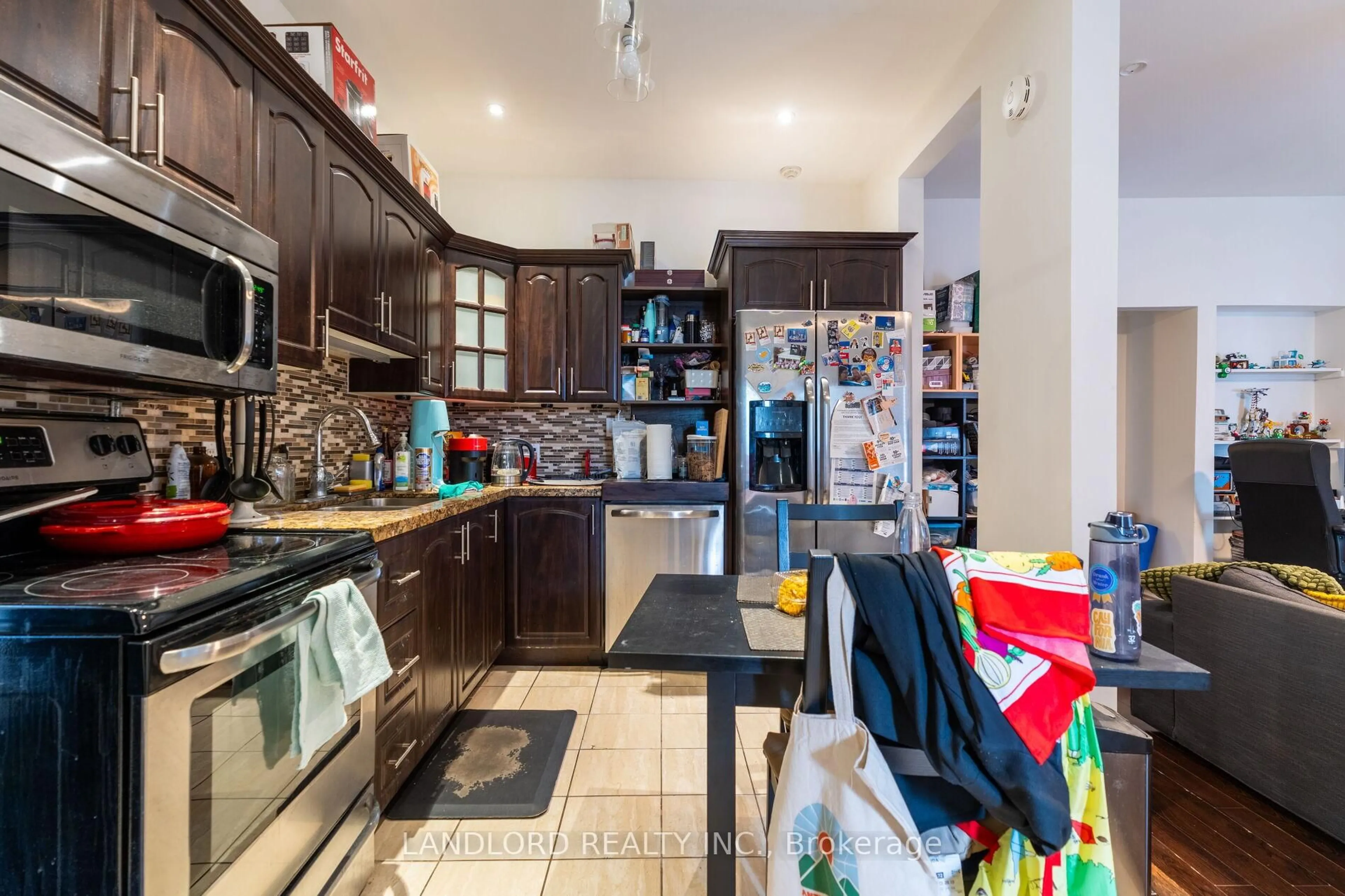 Open concept kitchen, ceramic/tile floor for 1111 Gerrard St, Toronto Ontario M4M 1Z9